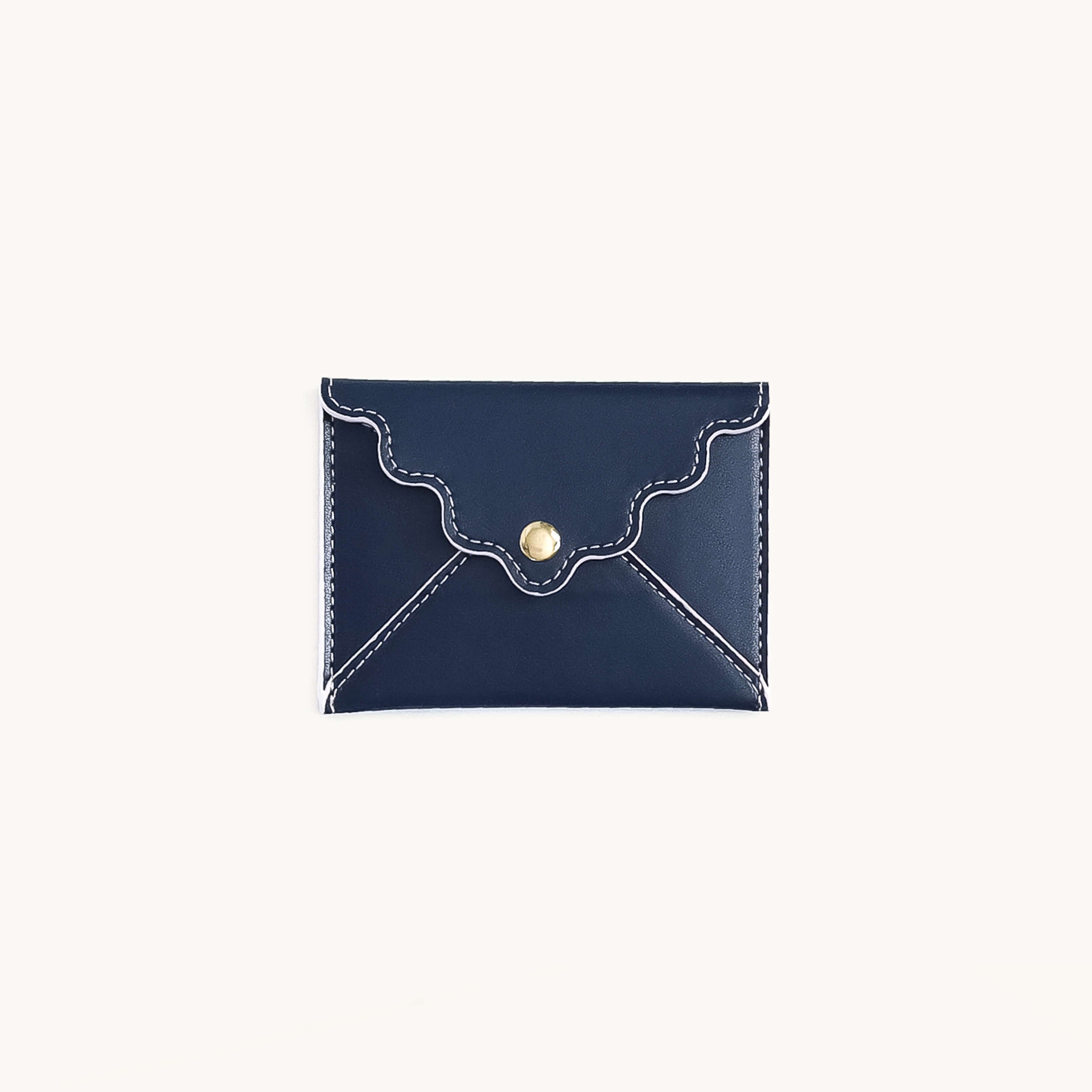 Navy leatherette mini wallet with scalloped flap and snap closure by Simplified by Emily Ley