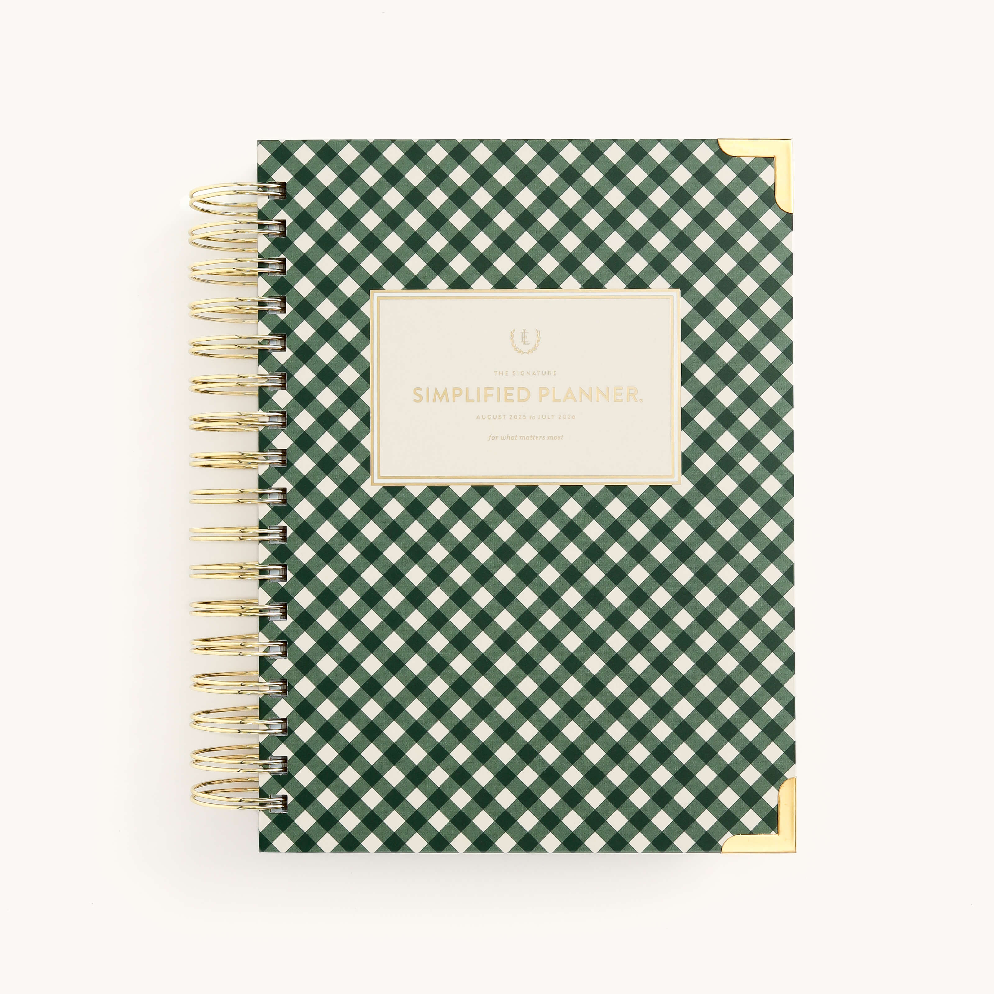 The 2025-2026 Spiral Daily Simplified Planner - Camp Gingham by Simplified features a green and white checkered cover with gold foil details, including a golden spiral binding and corner accents, plus an elegant rectangular label with Simplified Planner in gold.