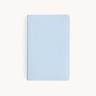 The Simplified 2025-2026 Dapperdesk Planner in Carolina Dot features a light blue leatherette cover with gold polka dots and embossed 2023 to 2026 text, offering an elegant, organized touch to your planning needs.