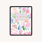 A digital tablet displays the 2025-2026 Digital Simplified Planner for iPads by Simplified, featuring a pink, purple, and blue watercolor floral cover with green leaves and a gold-bordered box reading Simplified Planner at the center.