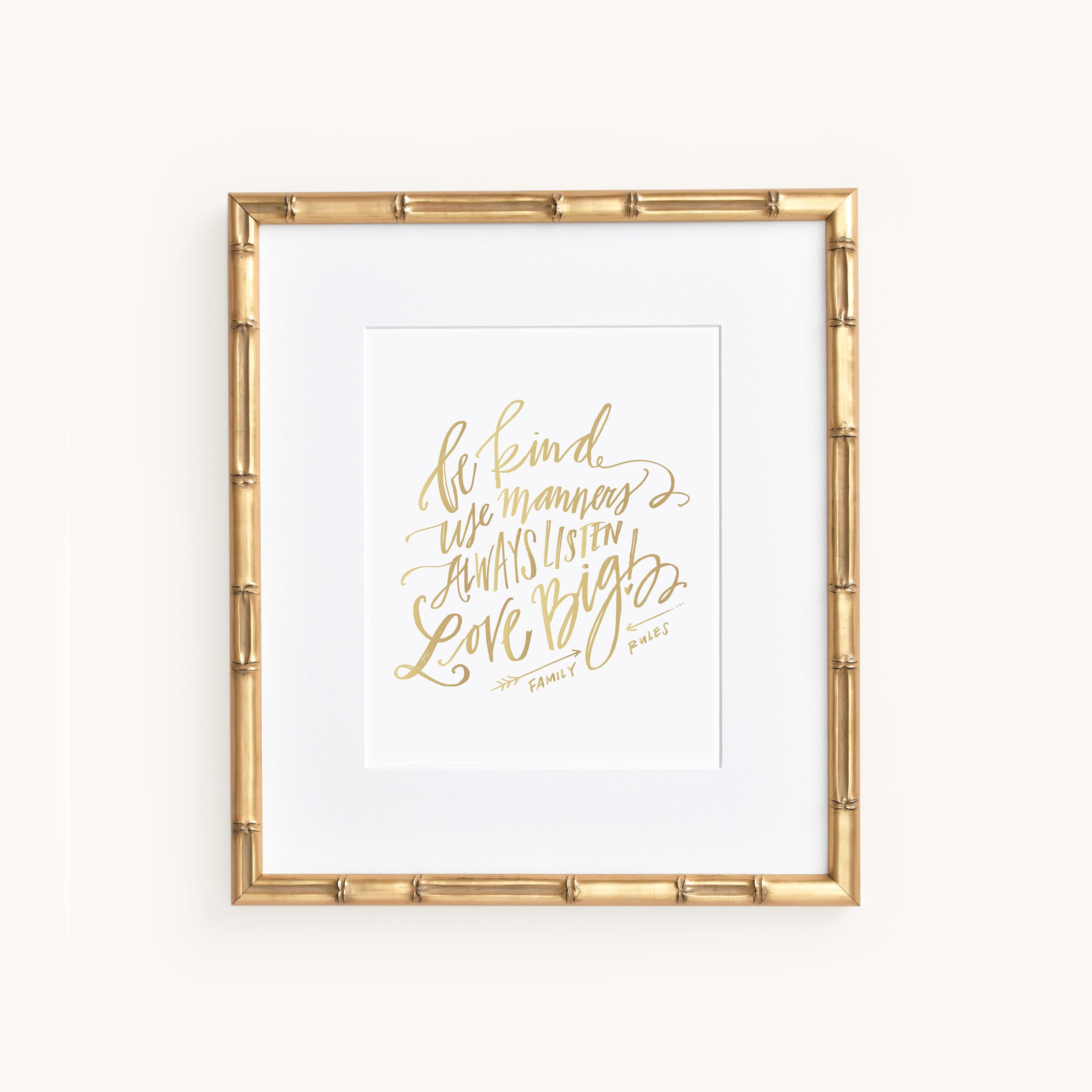 Simplifieds Art Print - Family Rules features elegant cursive text and the quote Be kind, use manners, always listen, love big in a sophisticated gold bamboo-like frame.