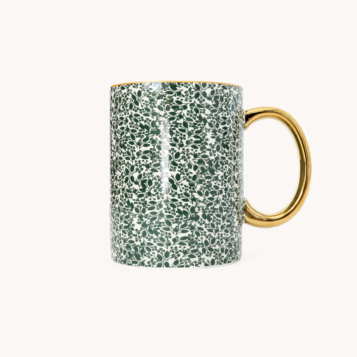 Emerald Floral Ceramic Mug in a dark green leaf and berry print on white with a glossy gold handle and gold rim