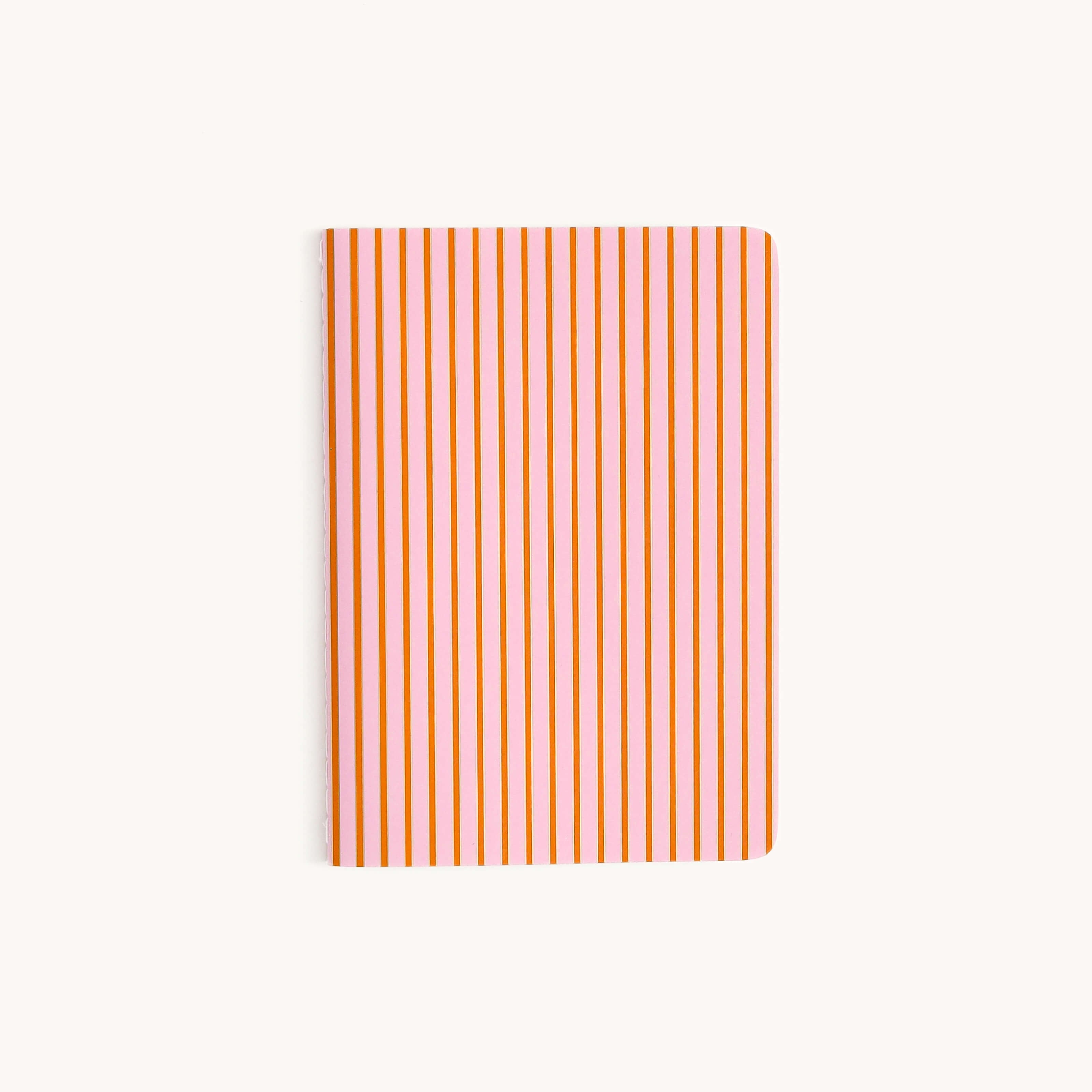 The Mini Notebook - Cabana Pinstripe by Simplified features a thick paper cover with vertical orange and white stripes on a light gray background.