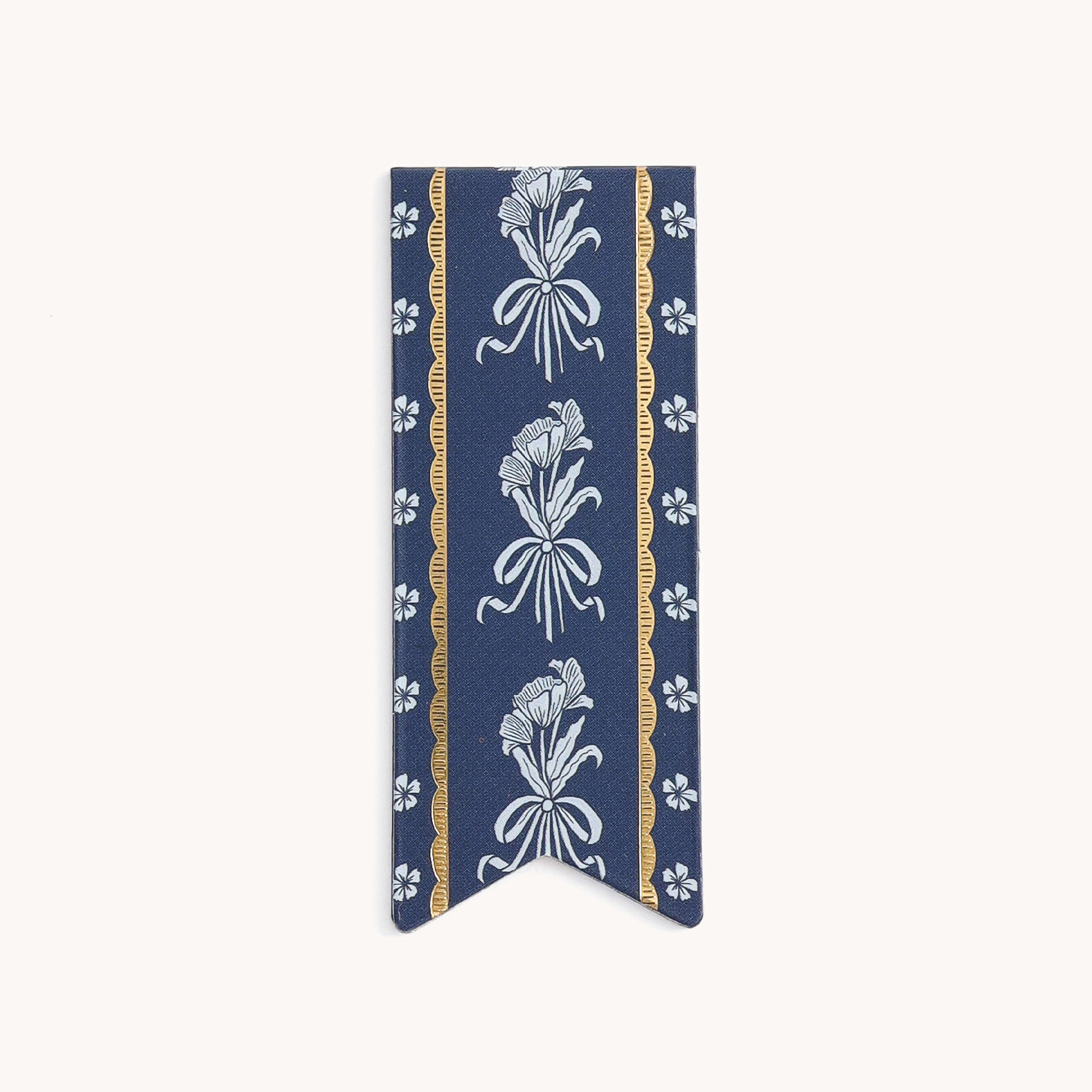 The Page Marker - Poppy Posies by Simplified is a flag-shaped fabric bookmark with a blue background, featuring vertical gold and blue floral patterns, ribbon-like leaves, and small white flowers, adding elegant charm to any planner or journal.