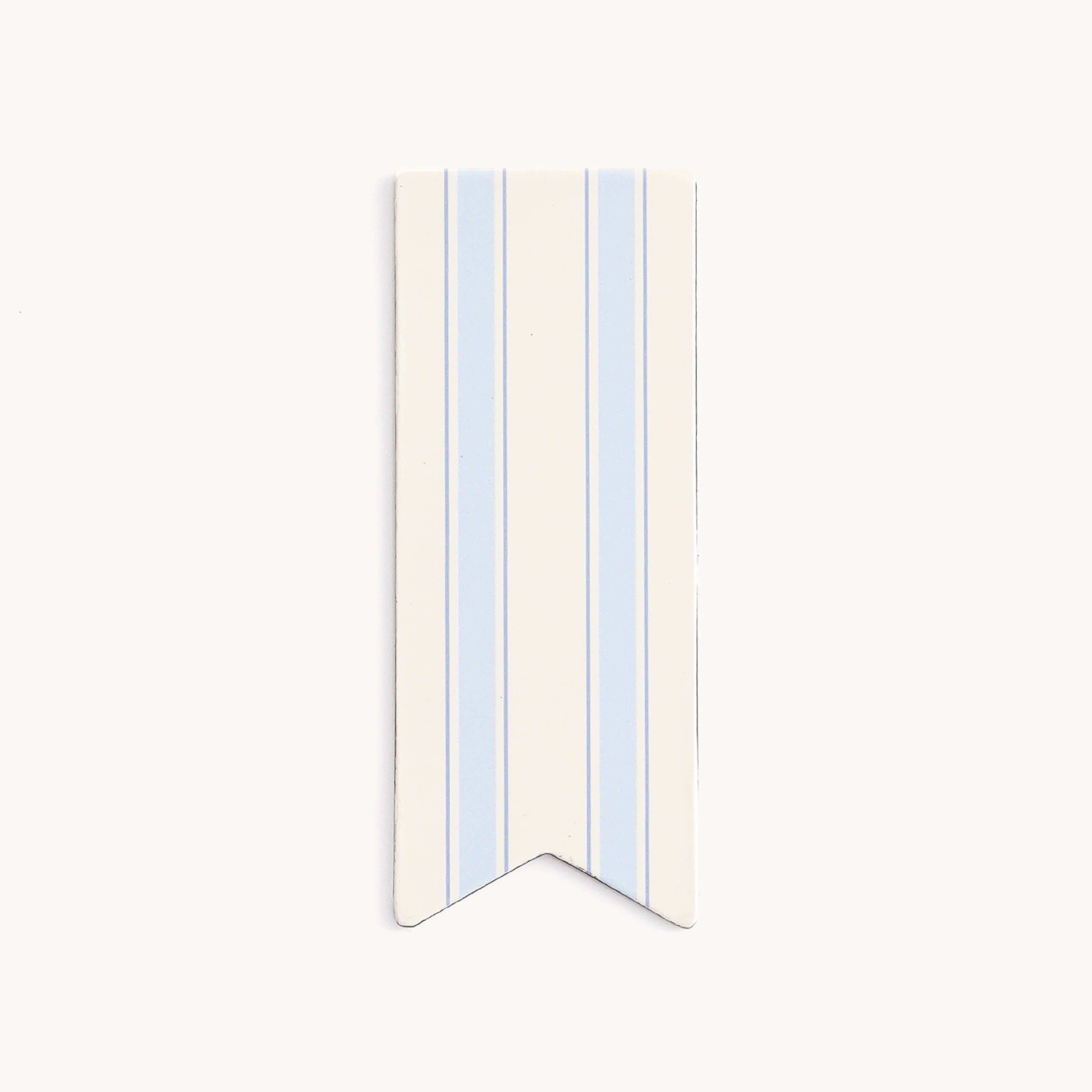 The Simplified Page Marker - Serene Stripe is a narrow, vertical page marker with light blue stripes on white. It has a pointed inverted V shape at the bottom, adding stylish organization to your planner.