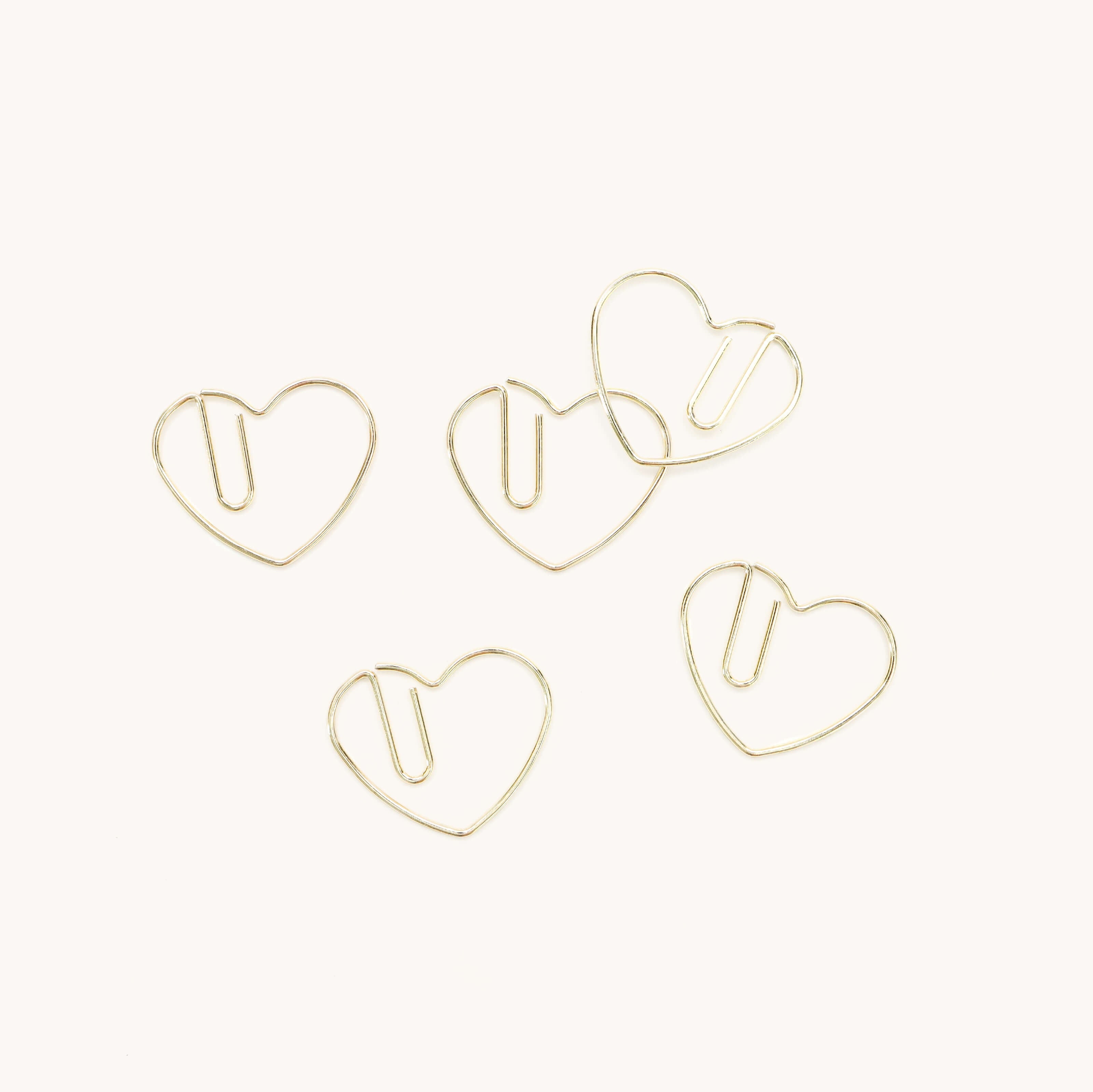 Five Simplified® by Emily Ley Paper Clips - Heart, crafted from durable metal, are arranged on a white background.