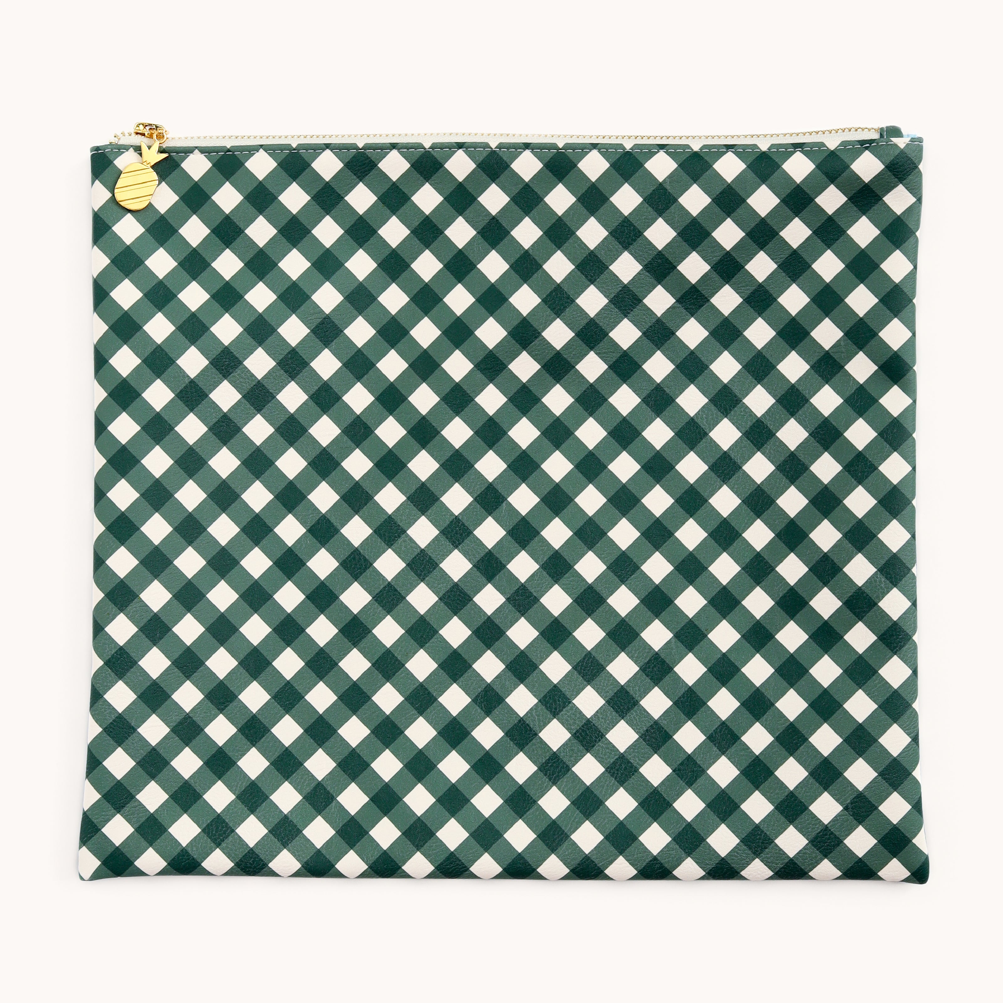 The Planner Pouch - Camp Gingham by Simplified is a stylish storage solution featuring a dark green and white checkered pattern with diagonal diamond shapes, set on a leatherette exterior. This square pouch includes a gleaming gold zipper adorned with a pineapple charm, ideal as an elegant planner accessory.