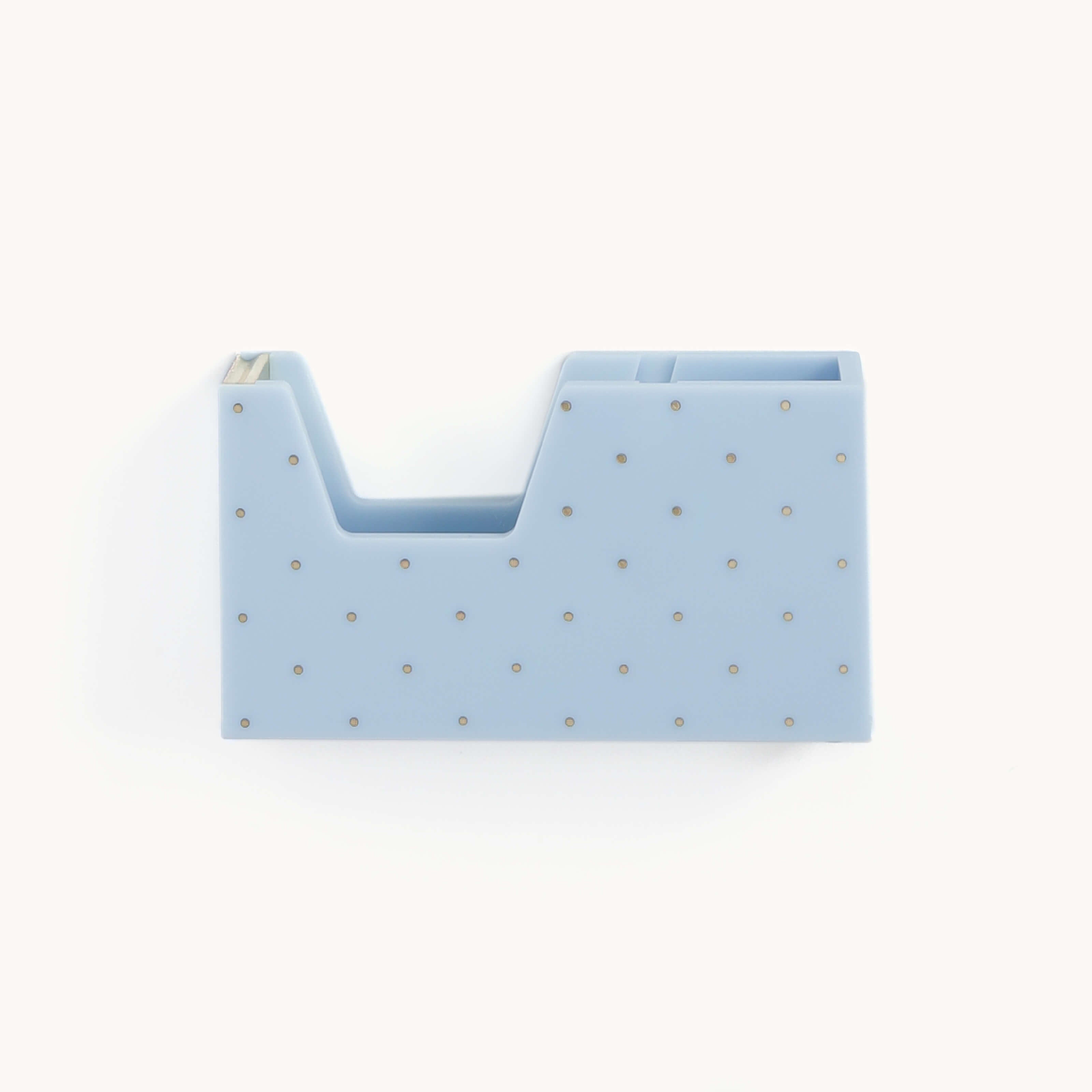 The Carolina Dot desk organizer by Simplified in light blue features a small dot pattern with two compartments—one open and one smaller—perfect for storing office supplies like pens or sticky notes.