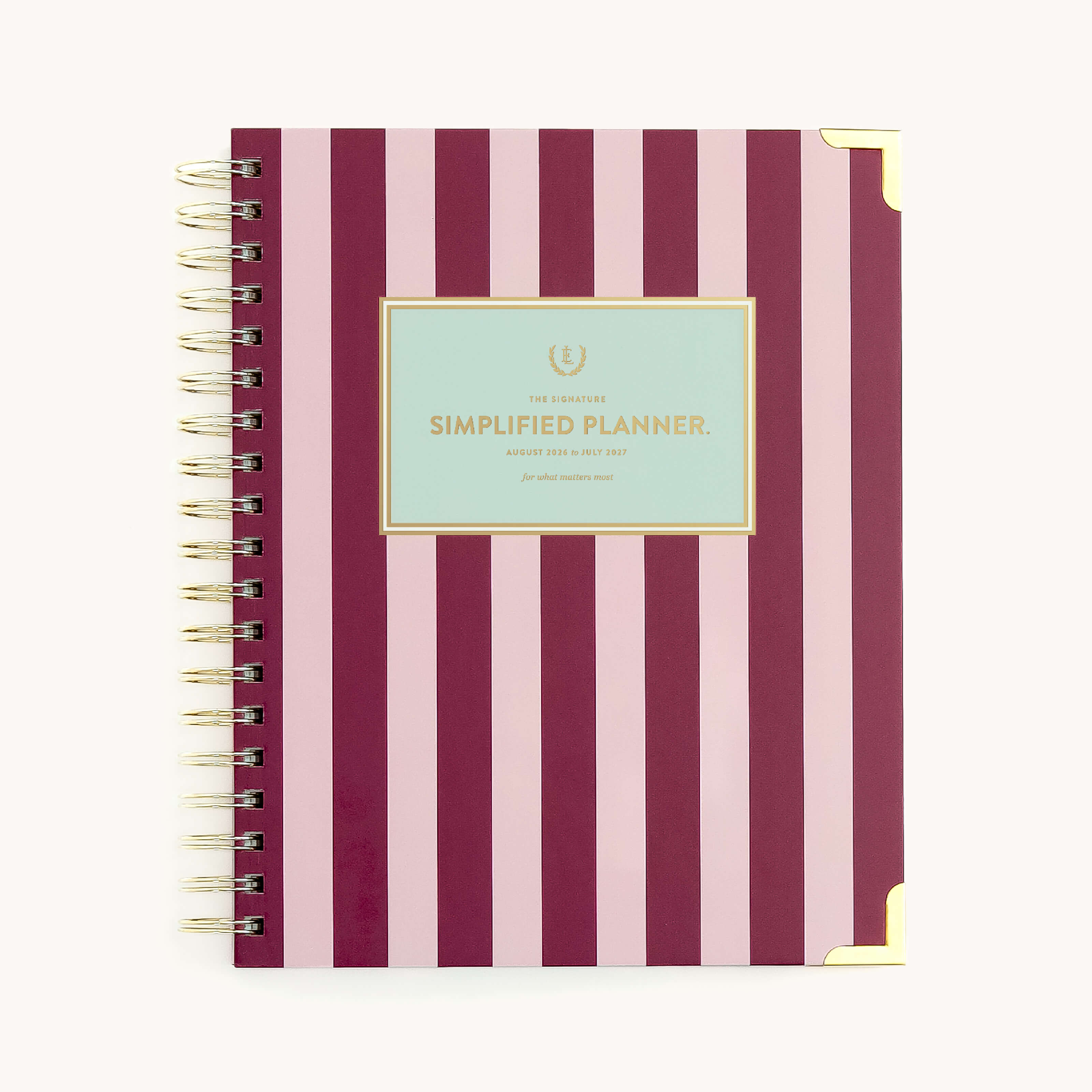 Berry Stripe spiral weekly planner with bold striped cover, gold corners, and wire binding for easy weekly planning