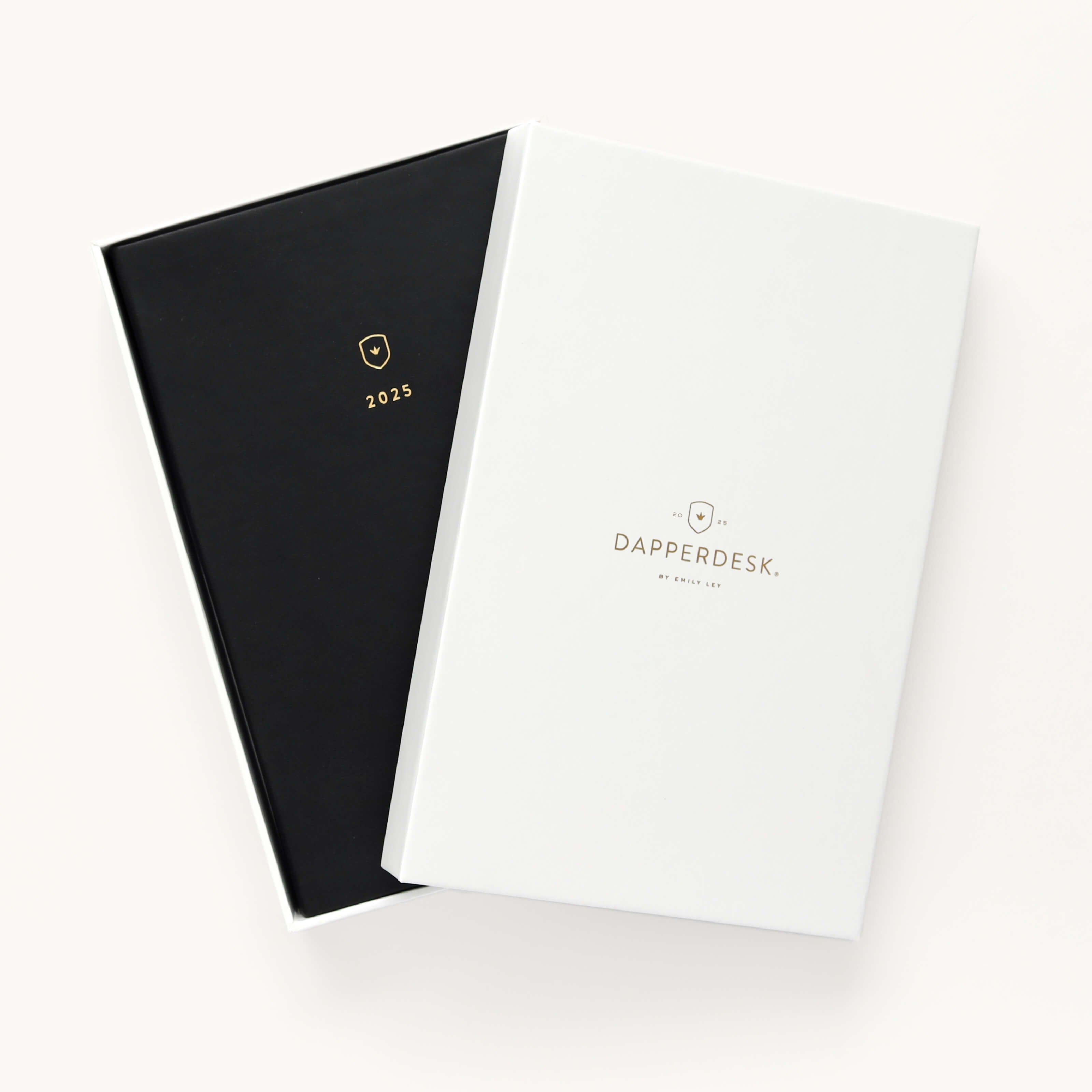 2025 Calendar Year Daily Dapperdesk Planner by Emily Ley featuring the Black Tie leatherette cover, placed inside a beautiful keepsake box with gold foil detailing designed for stylish storage.