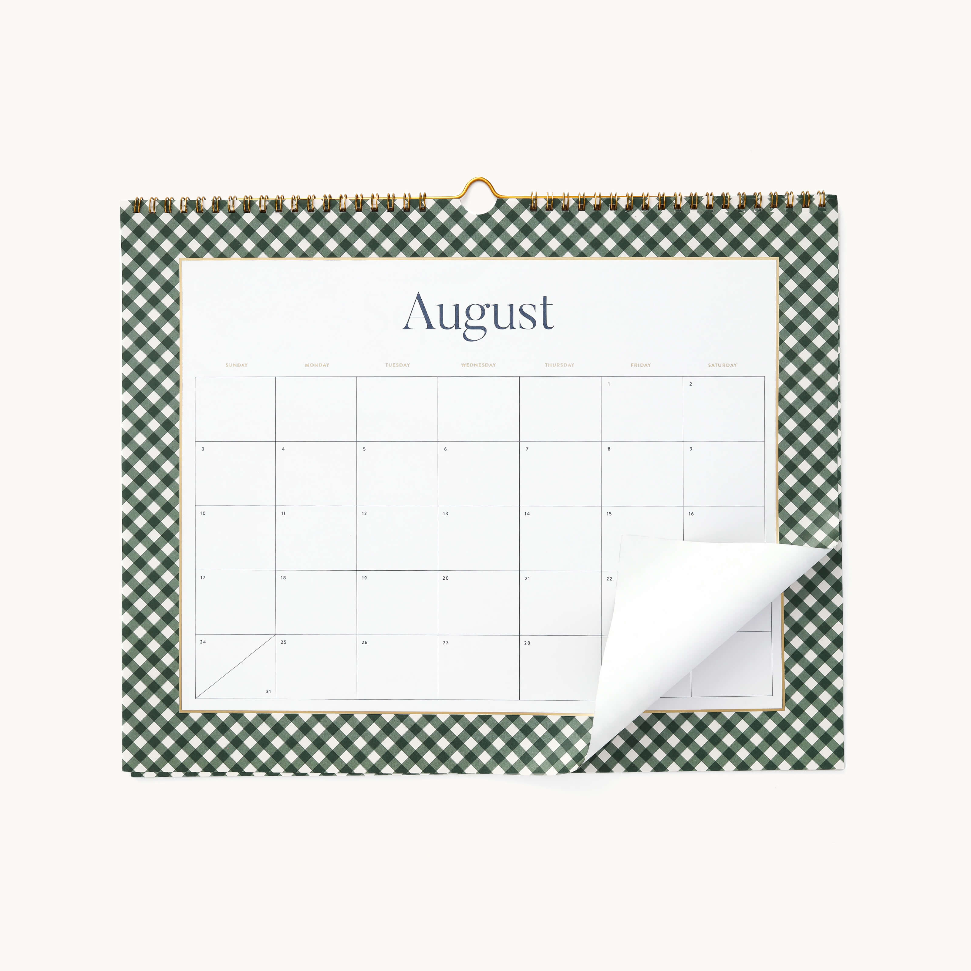 The 2025-2026 Wall Calendar by Simplified features the month of August with a green and white checkered border. A corner is slightly upturned, showing a white back. The days are blank without any markings or events.