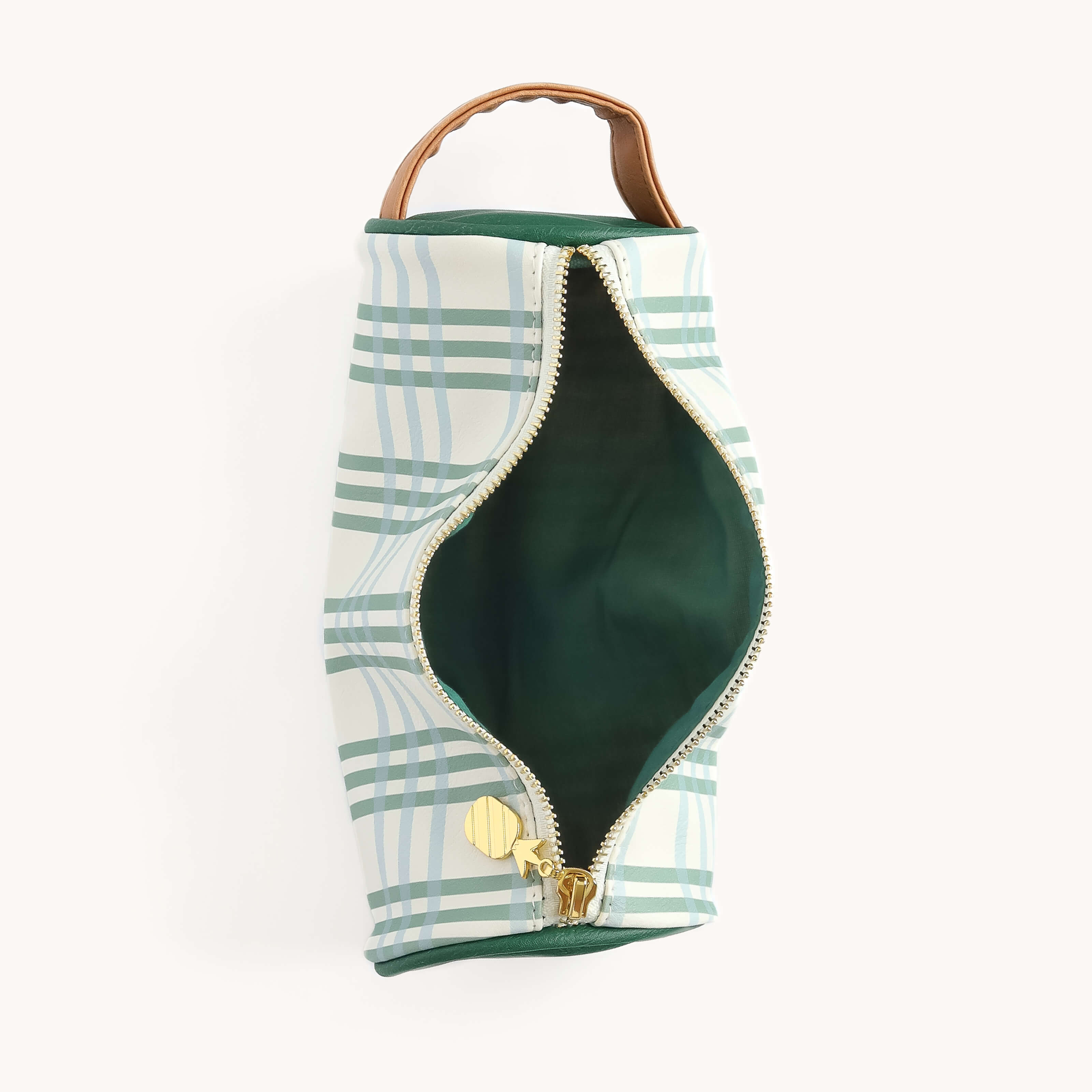 The Pen Case - Pistachio Plaid by Simplified is a vertically positioned green and white plaid fabric pouch with a leather handle and an open gold zipper, revealing its dark green interior, set against a white background.
