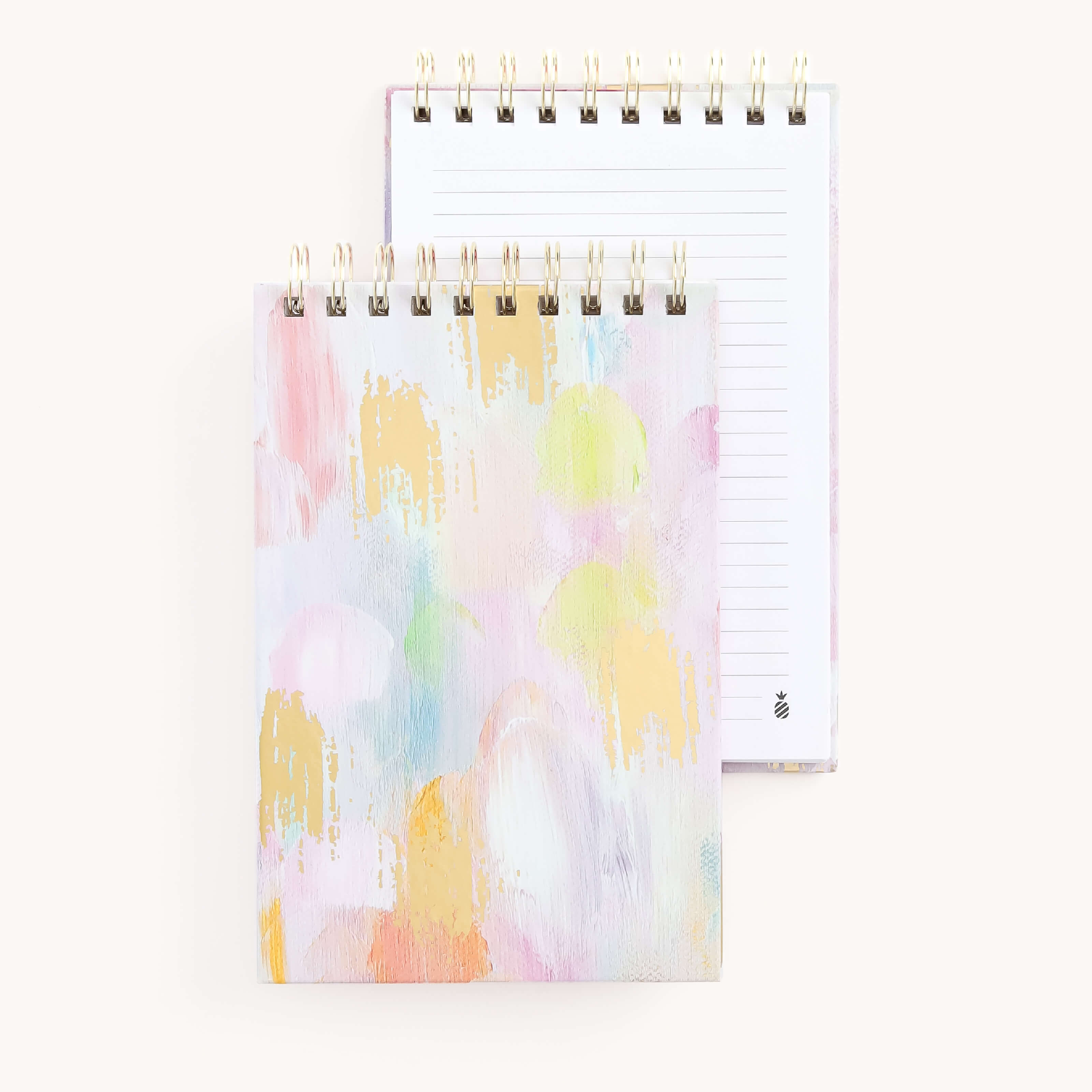 Two Simplified Top Spiral Notepads - Happy Abstract are showcased against a light background. The front cover features an abstract pastel design, with lined pages inside for writing. These notepads make perfect, thoughtful gifts combining beauty and functionality in every page.