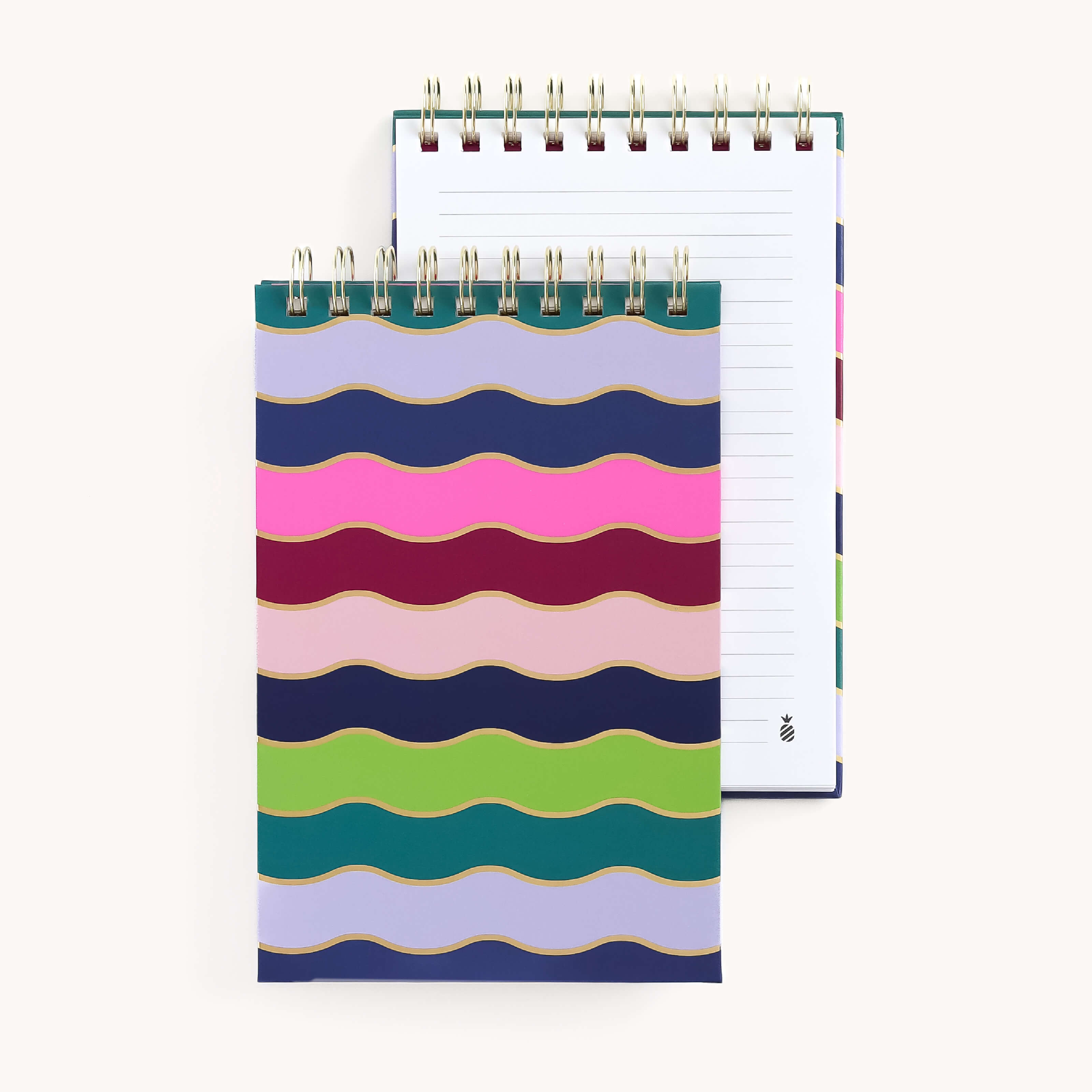 Two Top Spiral Notepads - Rainbow Row by Simplified are shown with the front cover displaying a wavy striped pattern in pink, blue, green, and gold, perfect for gifting. The back notebook reveals lined pages against an off-white background.