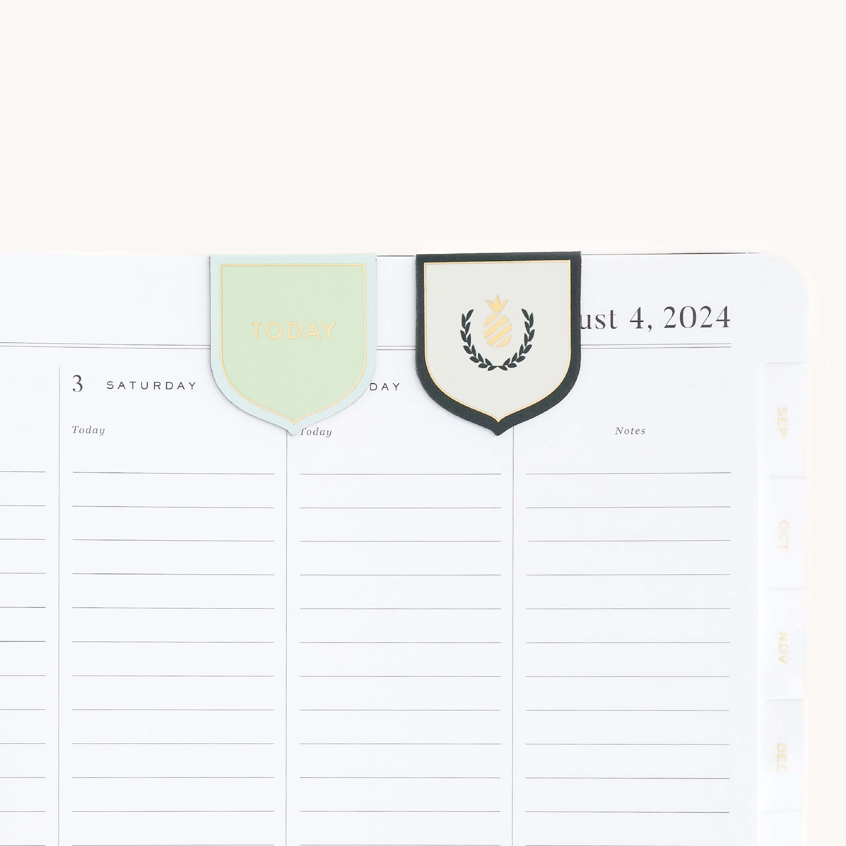 Simplified by Emily Ley | Magnetic Crest Page Markers attached to Planner page.
