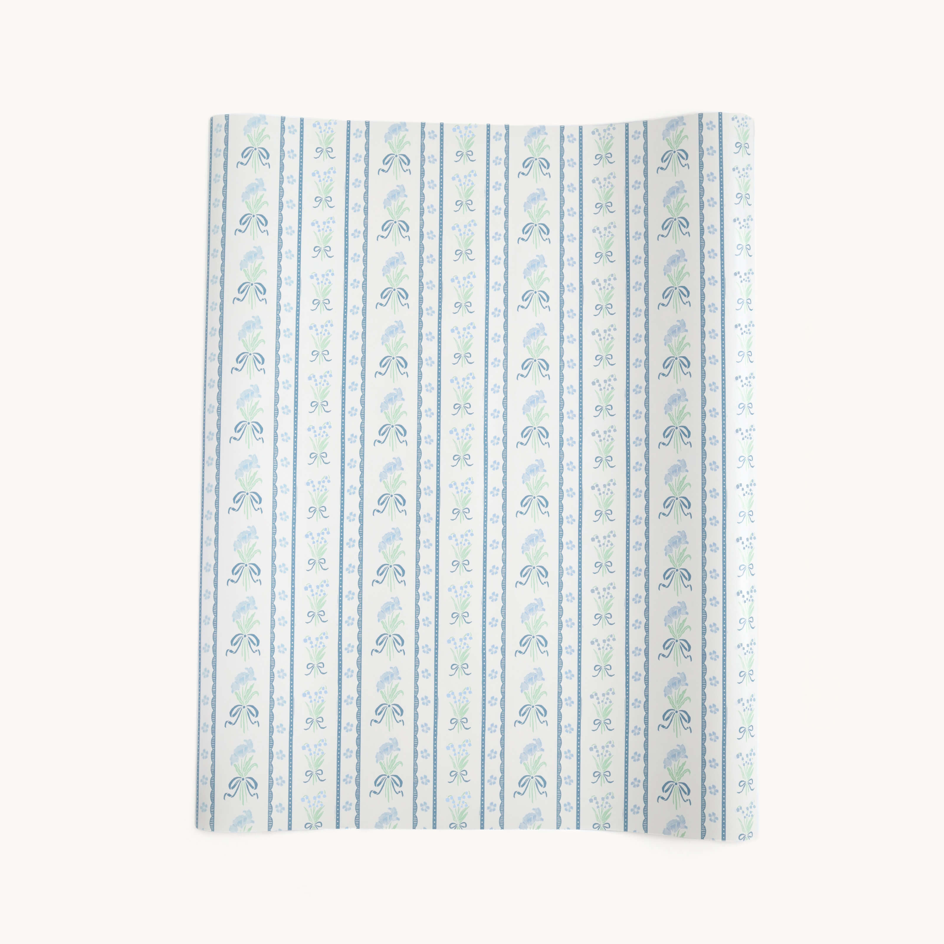 The Simplified Gift Wrap Roll - Block Floral features blue, green, and white vertical stripes with alternating floral and vine patterns, making it ideal for holiday gifts or creative gift wrap. Displayed slightly curved against a plain background.