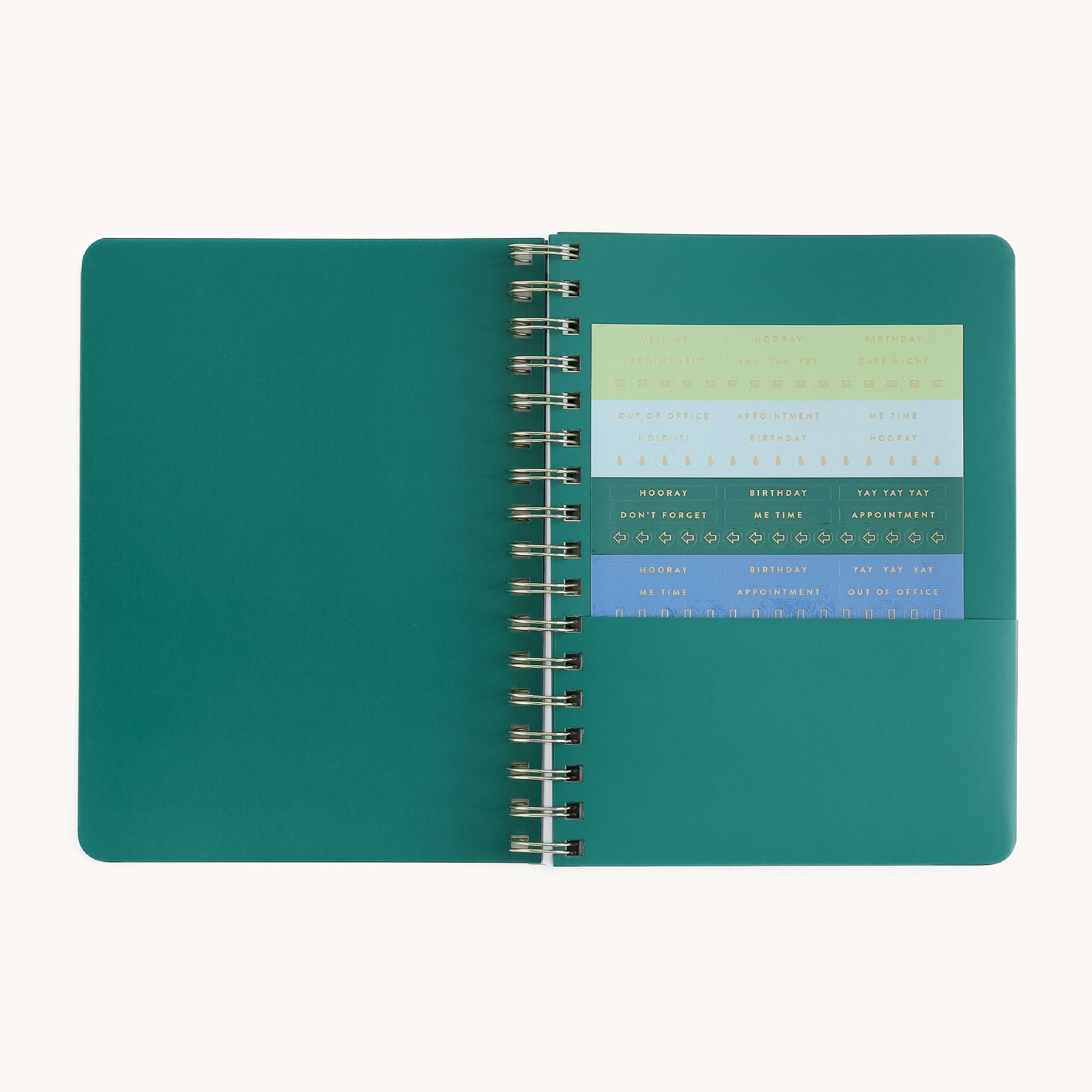 Small softcover weekly planner interior with storage pocket and sticker page for organizing notes, reminders, and weekly plans