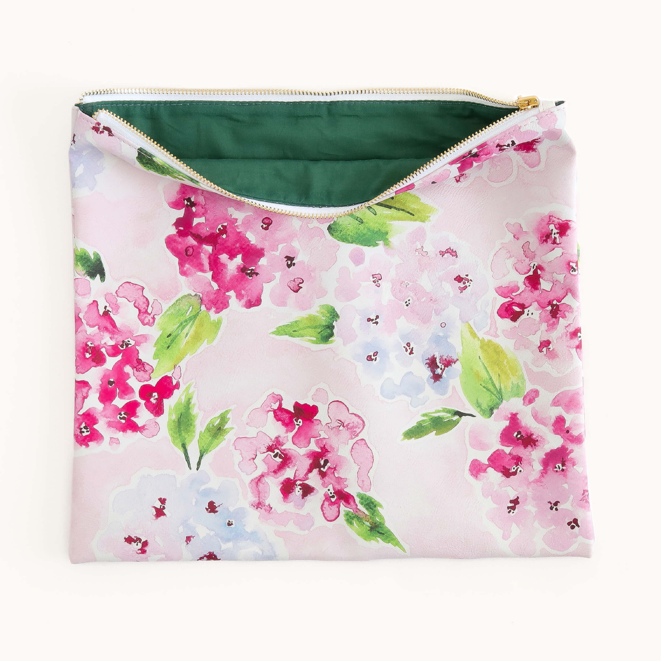 Blush Hydrangea pouch unzipped to reveal spacious interior with soft green lining for storing planners, pens, and accessories
