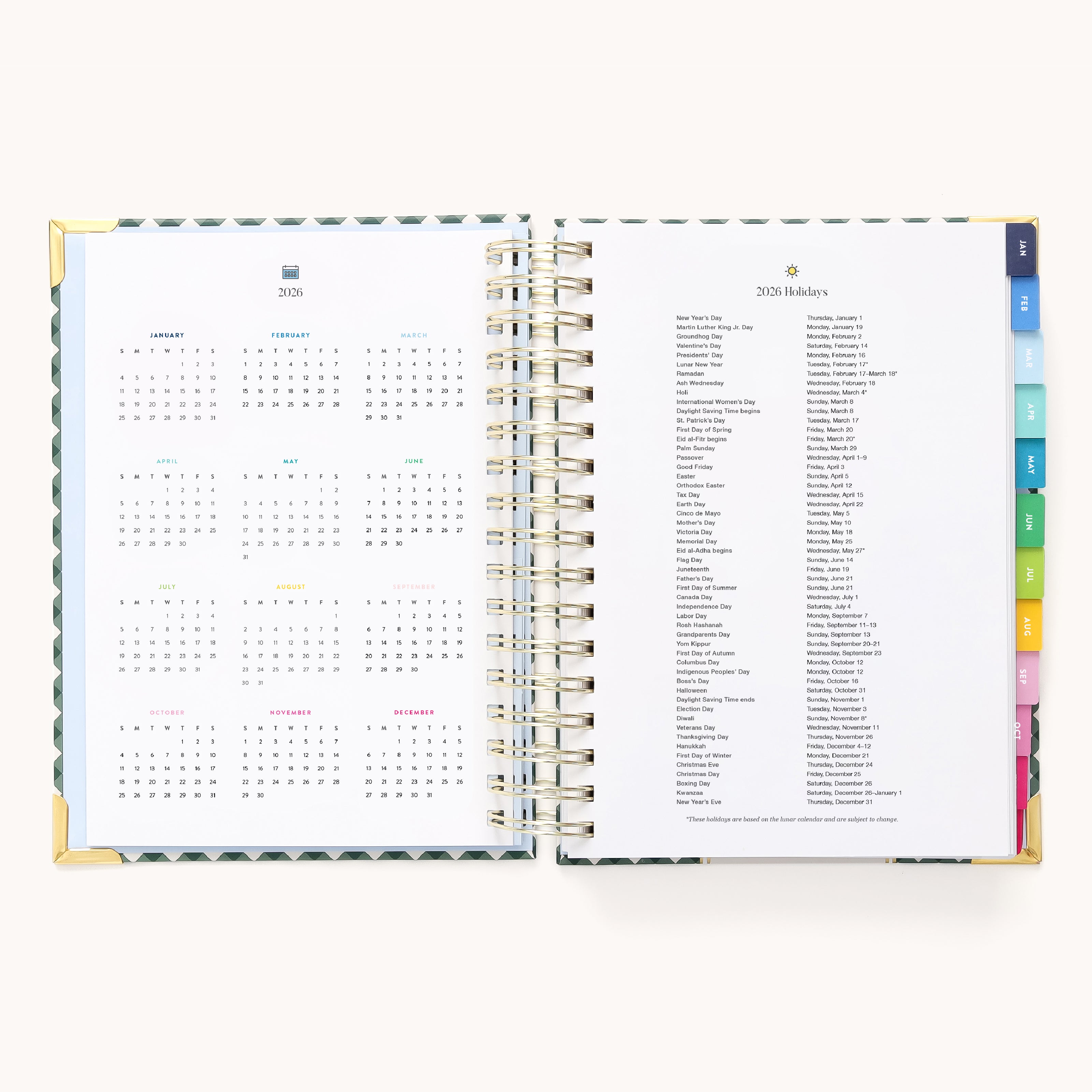 The 2026 Spiral Daily Simplified Planner by Simplified in Camp Gingham features gold spiral binding, colorful index tabs, the 2026 yearly calendar on the left, and a list of 2026 holidays on the right—ideal for organizing your year.