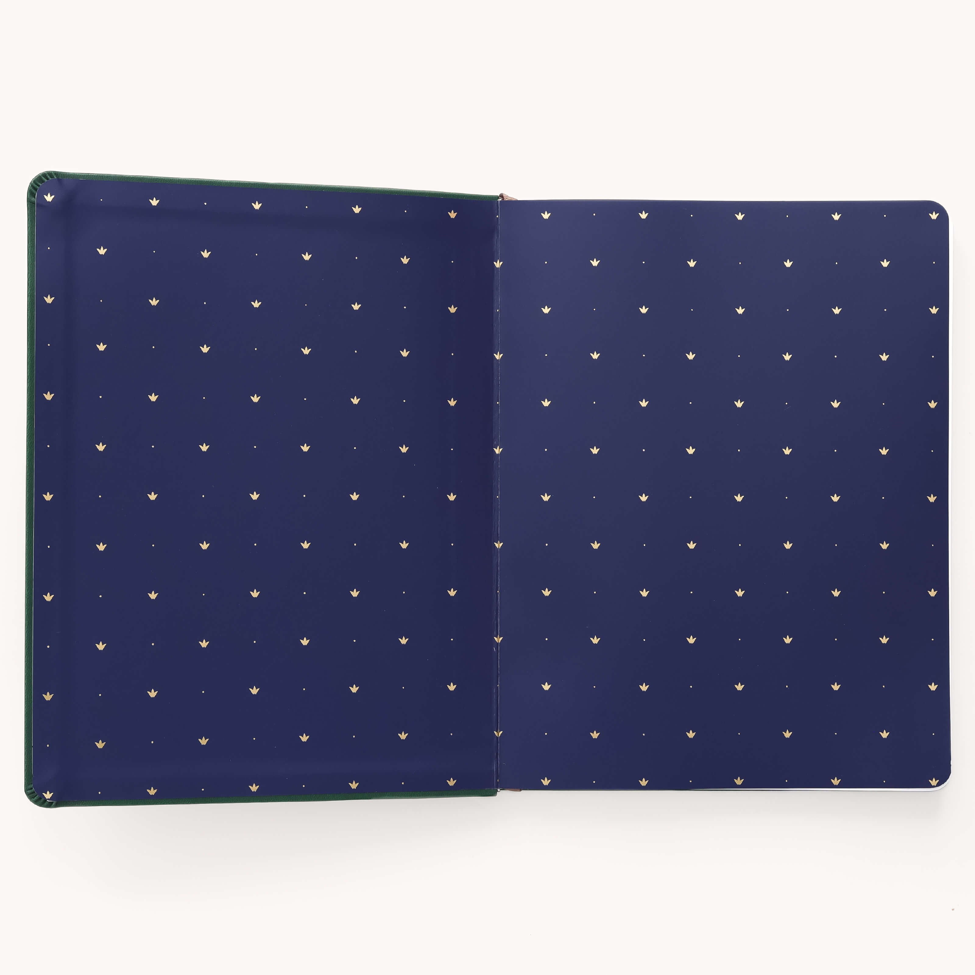 A stylish open navy folder with small gold dots, perfect for storing your Simplified 2026 Bookbound Weekly Dapperdesk Planner - Evergreen.