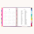 The Simplified 2026 Spiral Weekly Simplified Planner - Rainbow Row features a full calendar on the left page, 2026 holidays on the right, and colorful tab dividers for a vibrant, practical touch.