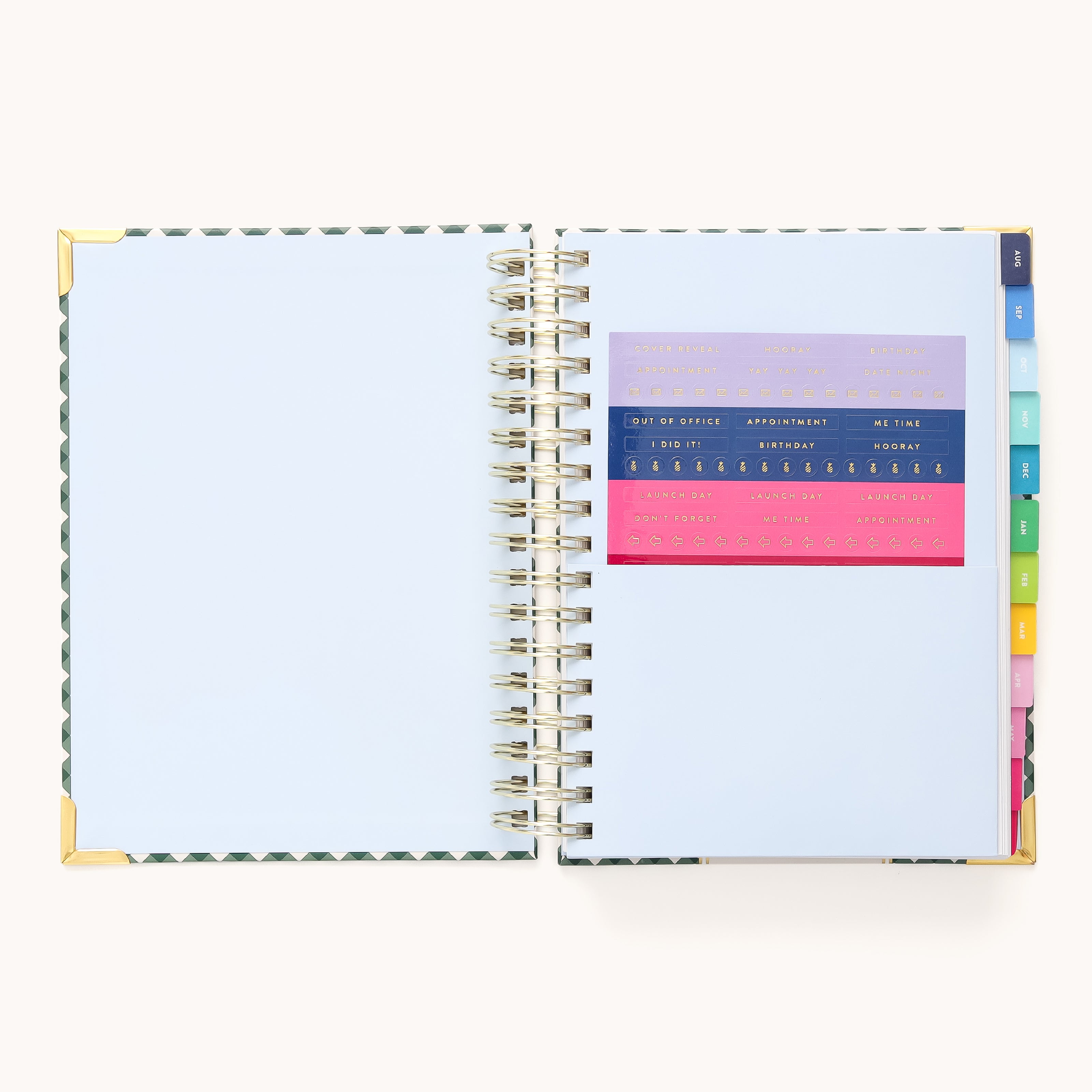 The 2025-2026 Spiral Daily Simplified Planner - Camp Gingham by Simplified features blank white pages with gold foil accents on the corners, colorful tab dividers on the right, and colored stencils with letters and numbers on the left, making it perfect for your prep work.