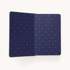 The 2025-2026 Bookbound Daily Dapperdesk Planner by Simplified has a dark blue cover with golden heart patterns, perfect for detailed planning or as a daily planner.
