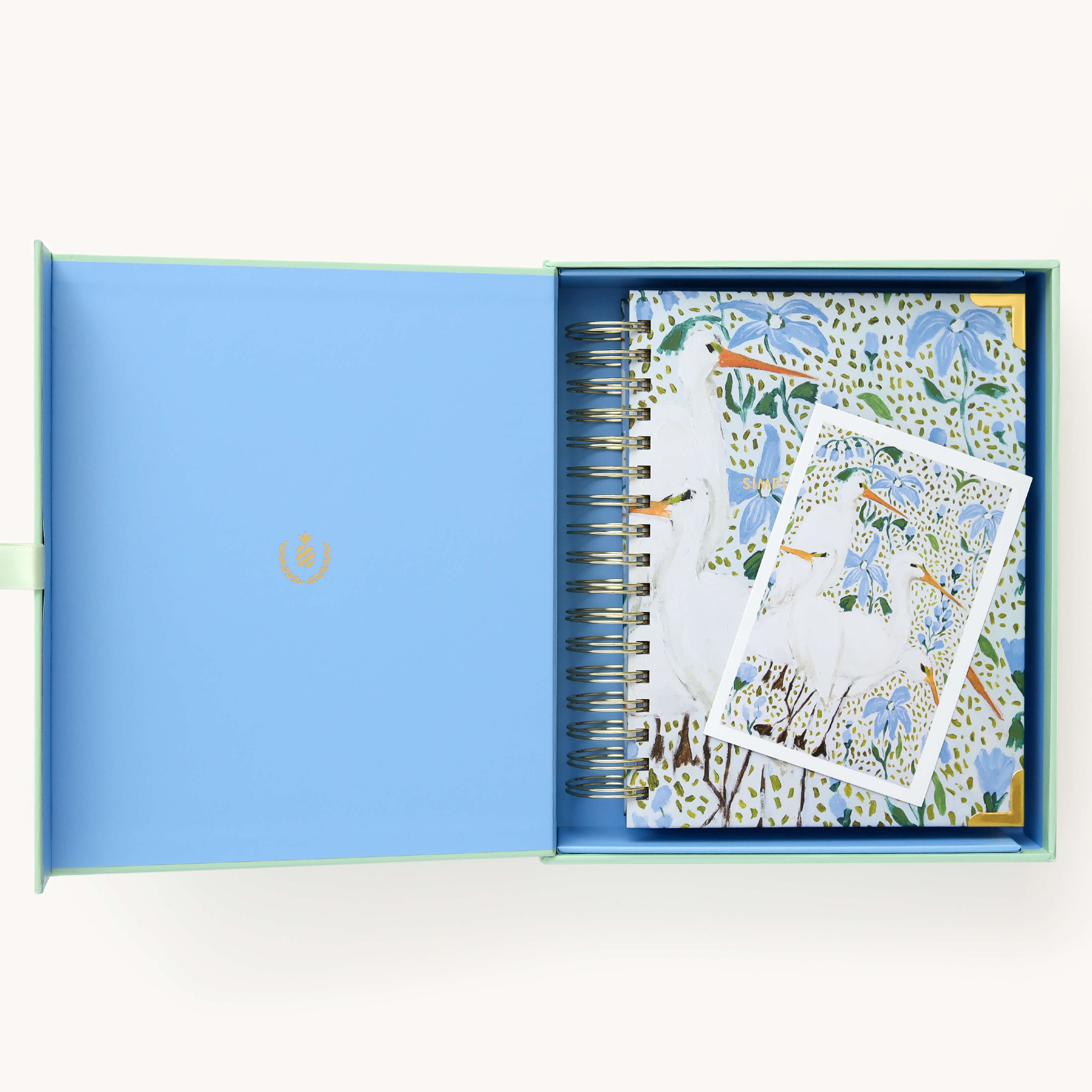 2025 Calendar Year Daily Simplified Planner by Emily Ley in the Beaufort Birdies cover design, placed inside a light blue and green keepsake box with gold foil detailing. Includes a matching art print for added inspiration. Perfect for organization, time management, and productivity.