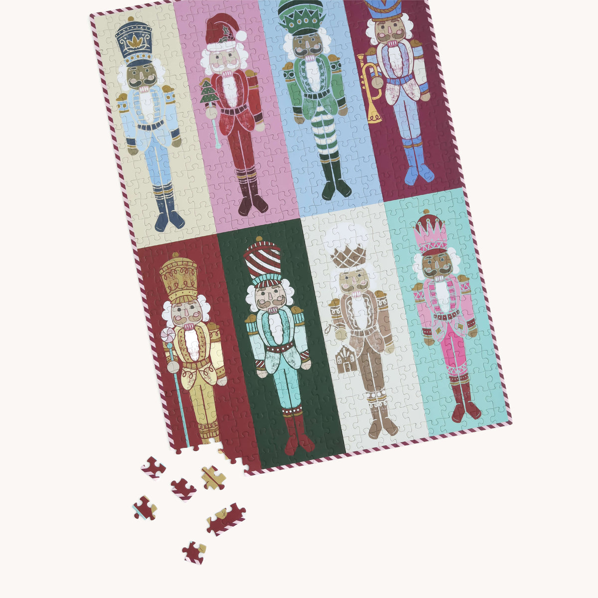 Nutcrackers 500-Piece Jigsaw Puzzle completed, with a handful of loose pieces scattered near one corner