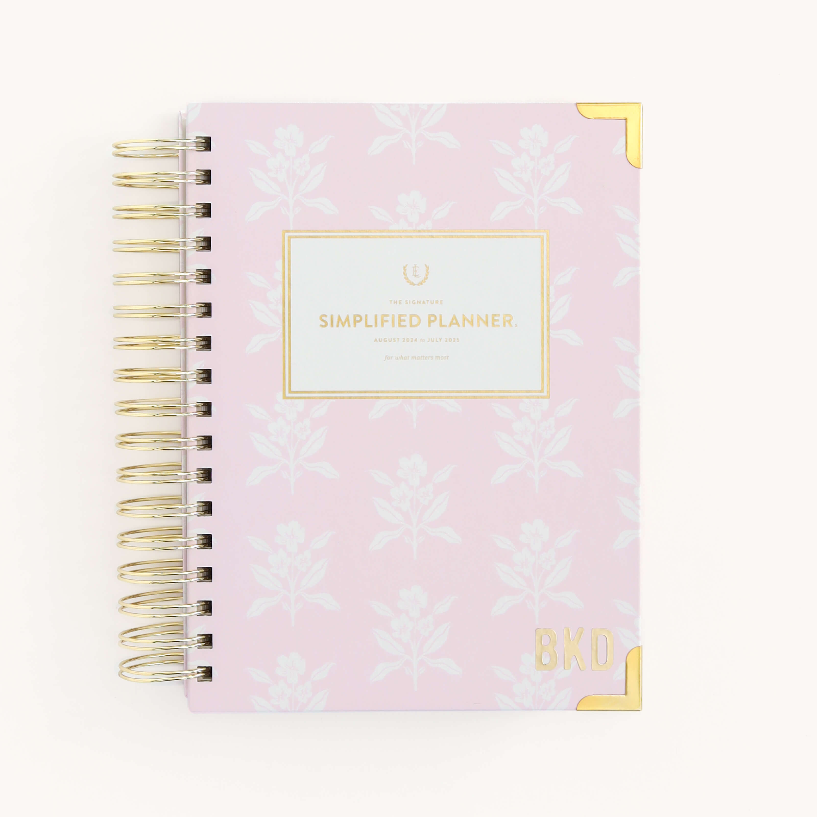 Modern Monogram Vinyl Sticker applied to a Blush Block Simplified Planner cover.