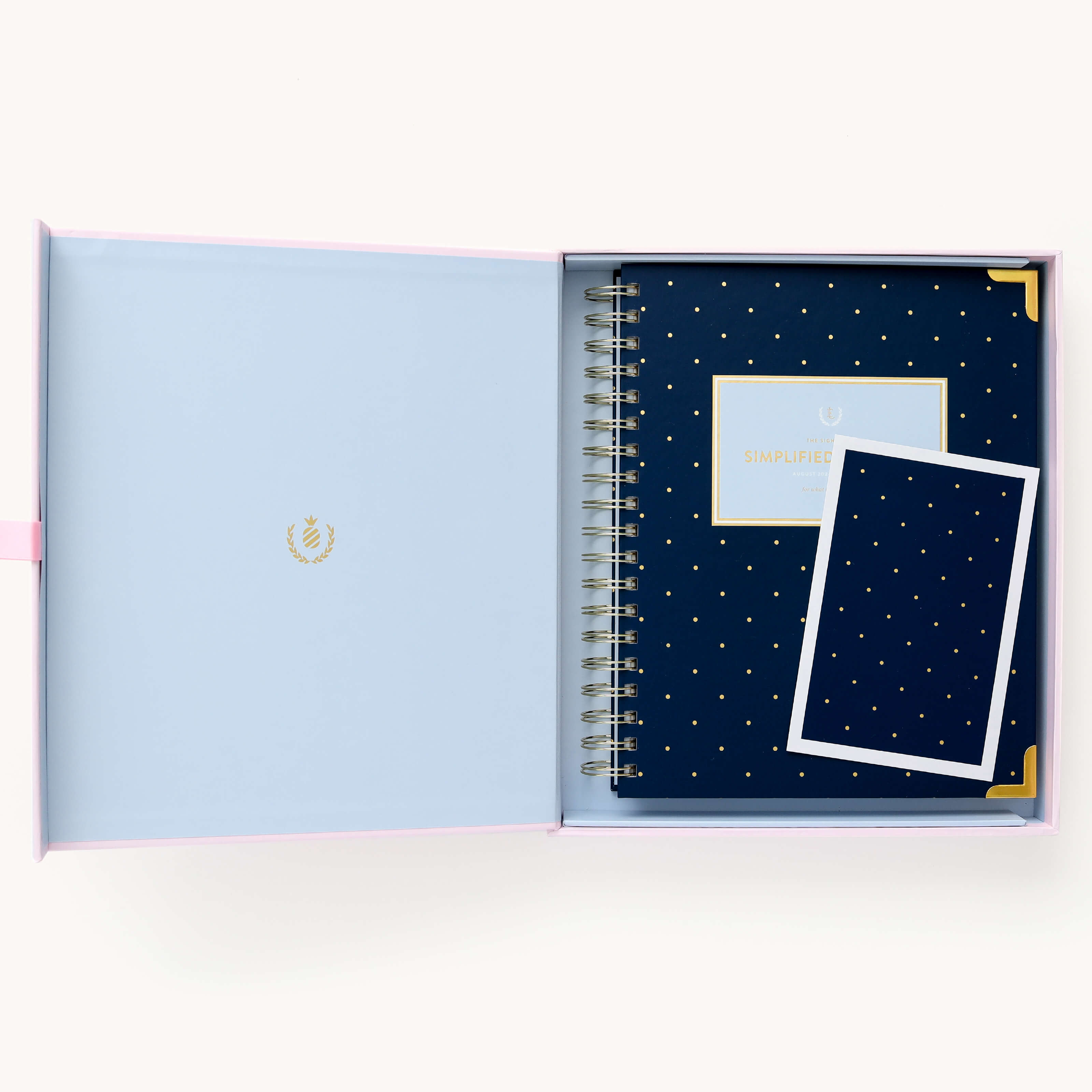 2025 Calendar Year Weekly Simplified Planner by Emily Ley in the Dainty Dot cover design, placed inside a blush pink keepsake box with gold foil detailing. Includes a matching art print for added inspiration. Perfect for organization, time management, and productivity.