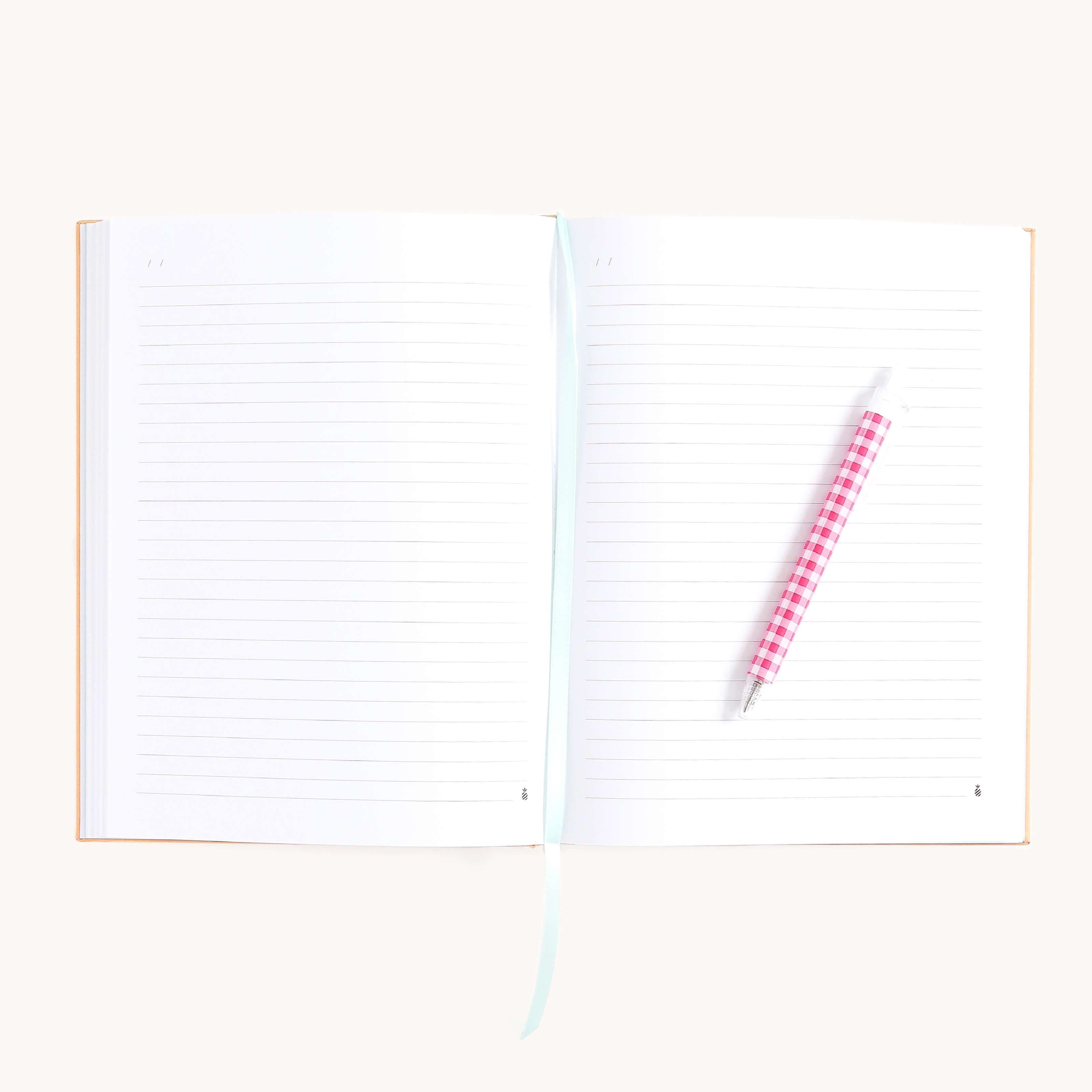 Cheetah Linen Journal open to lined pages with ribbon bookmark and pen, perfect for journaling thoughts, notes, and daily reflections