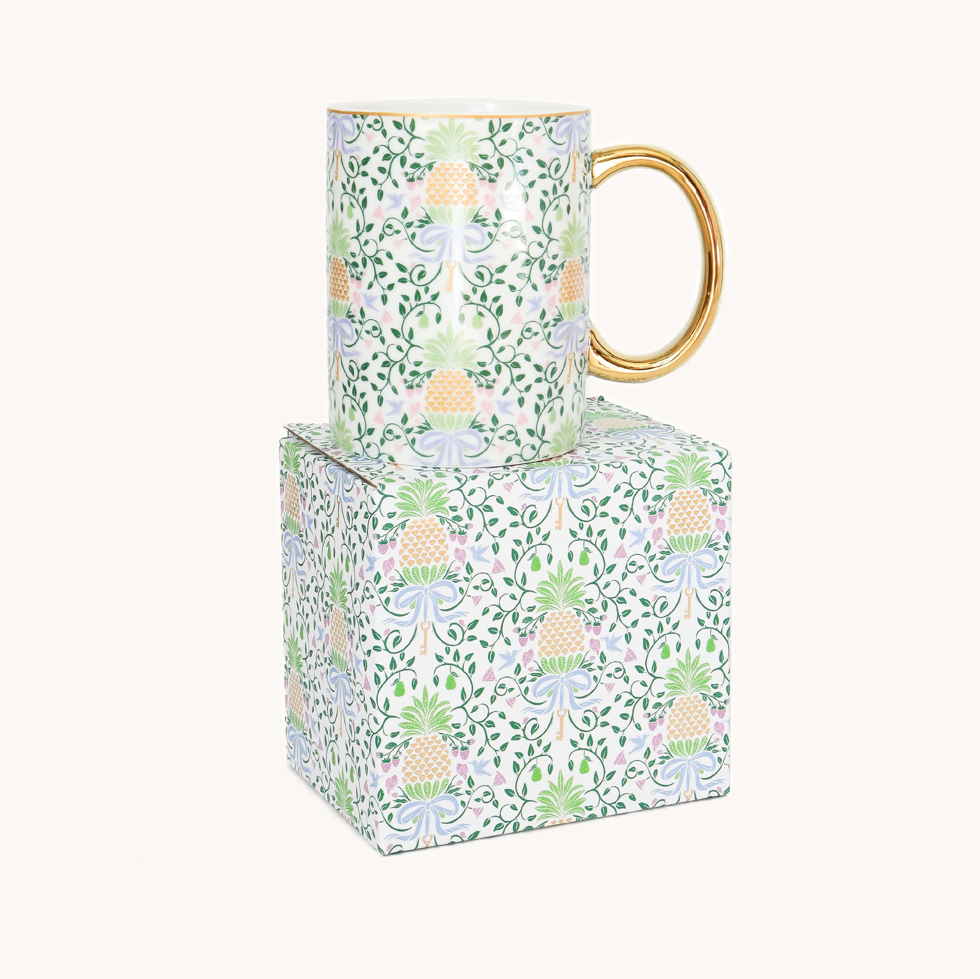 Pineapple Charm mug on top of box