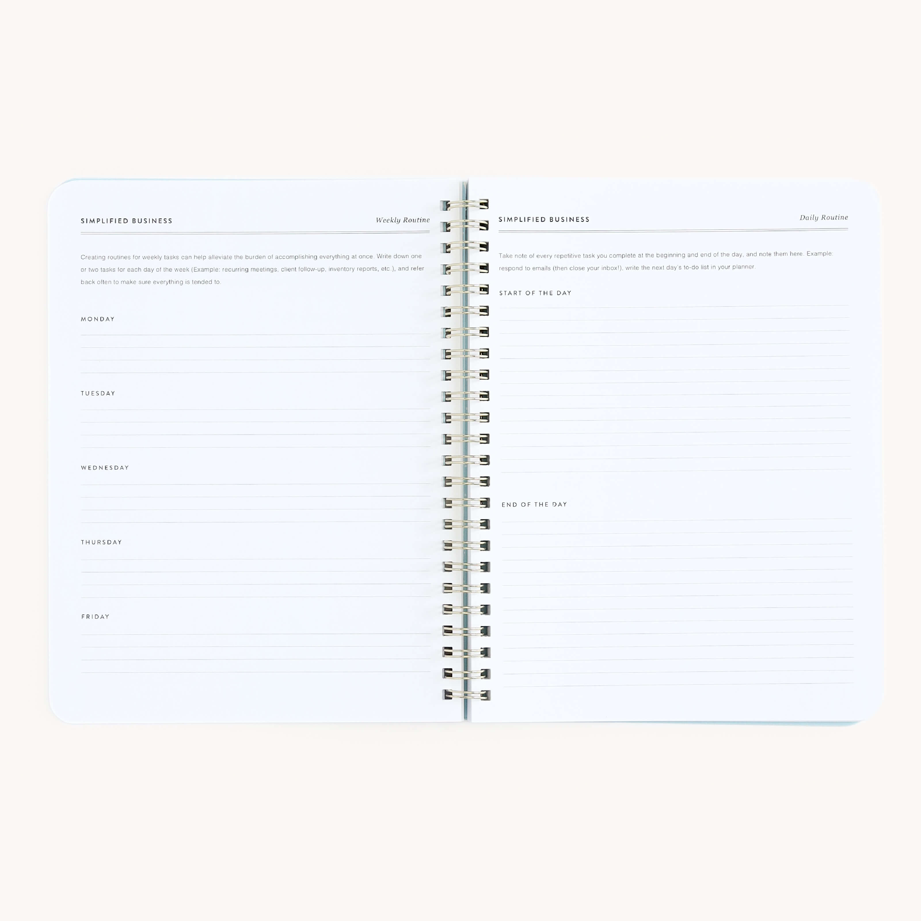 The Simplified Workbook - Entrepreneurship is a minimalistic, open spiral-bound notebook featuring faint text, ideal for your next business ideas. It includes a weekly planner with sections for each weekday and areas labeled Start of the Day and End of the Day, set against a light background.