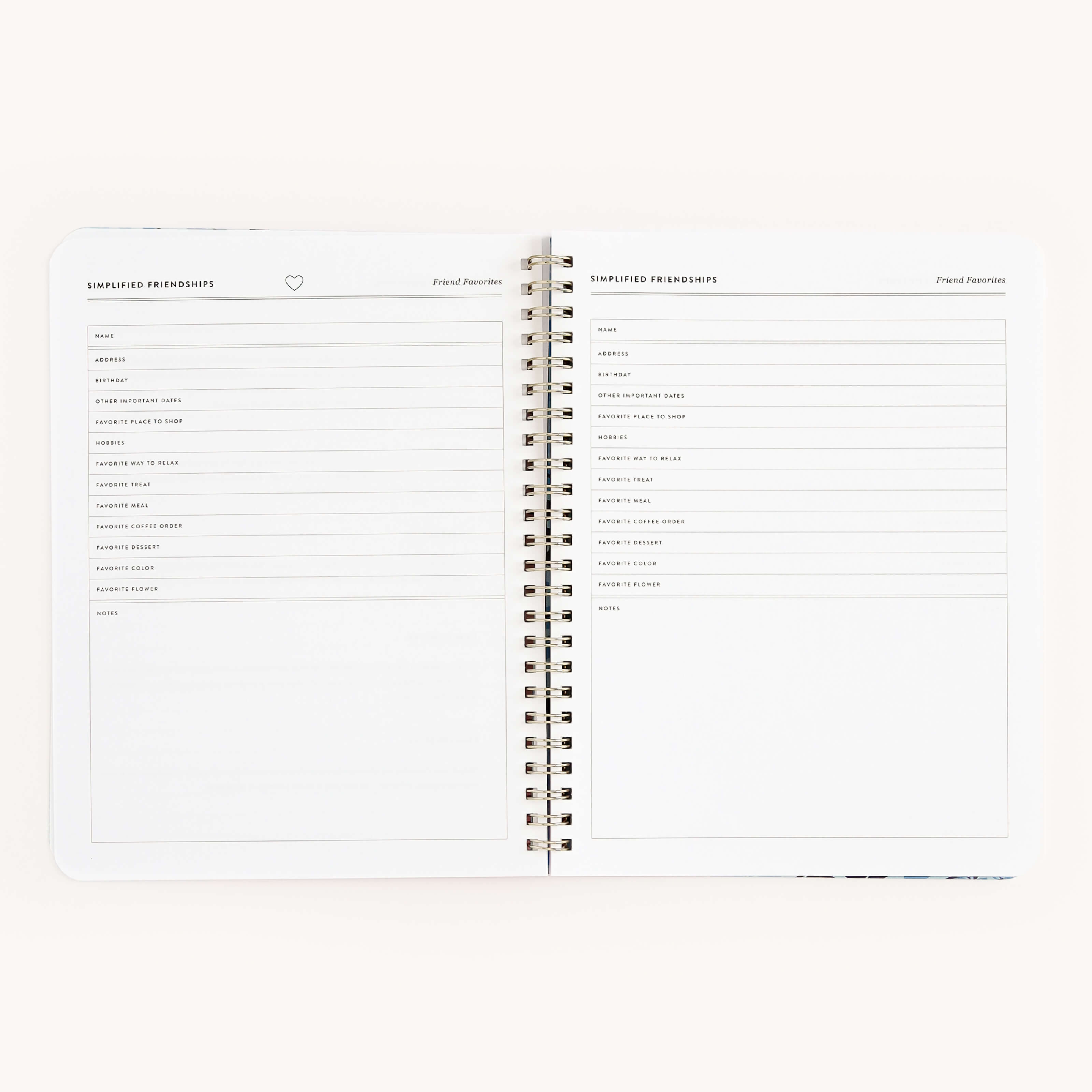 The Workbook - Friendship by Simplified is an open spiral-bound notebook featuring pages titled Simplified Friendships and Friend Inventory. It includes sections for names and details, supporting growth. The left pages notes section encourages writing actionable plans for valuable connections.