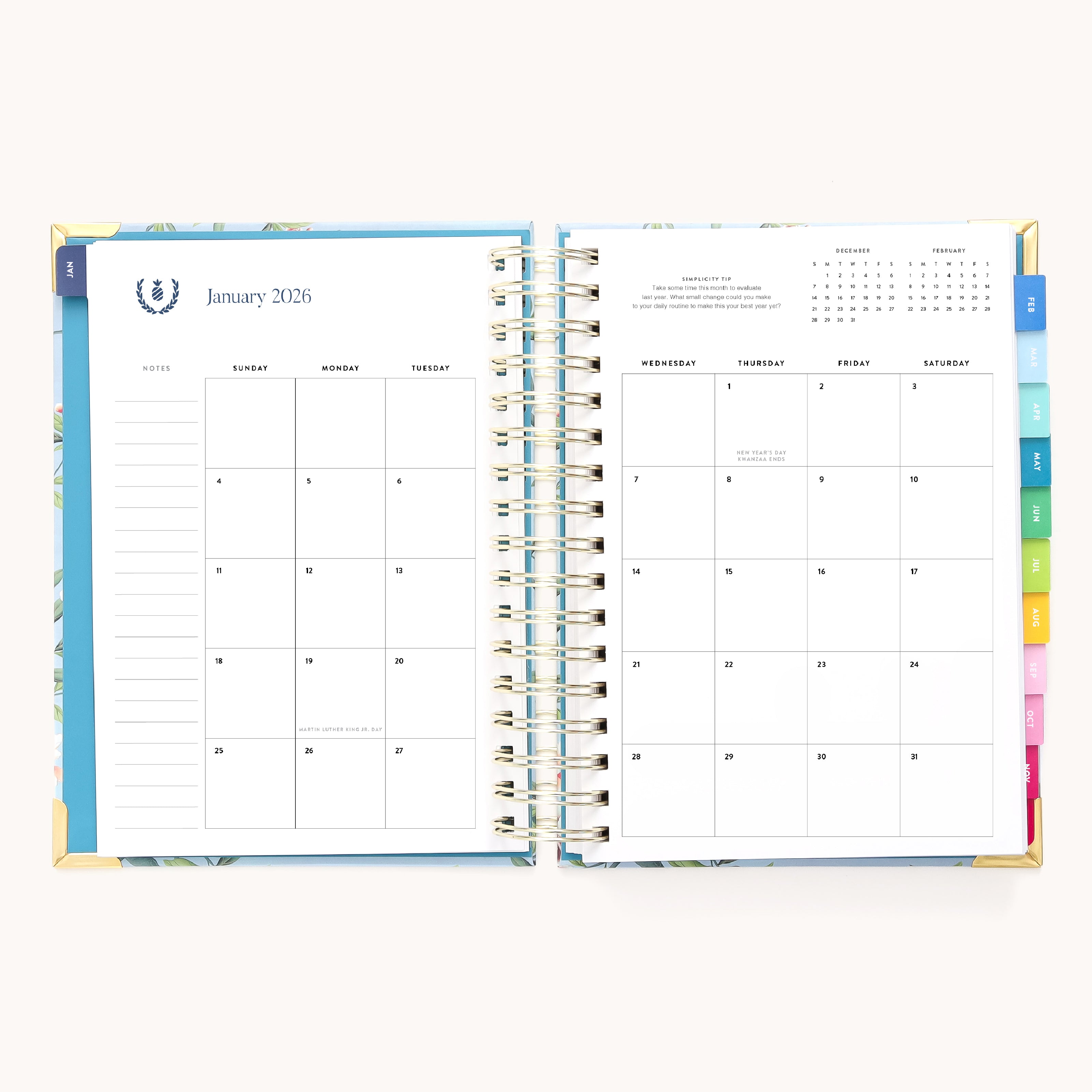 The 2026 Spiral Daily Simplified Planner - Faraway Land by Simplified shows January’s monthly calendar with note space on the left, colorful tabs, a hand-painted pattern, and a small February 2026 calendar in the top right corner.