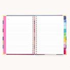 The 2026 Spiral Weekly Simplified Planner - Rainbow Row by Simplified lies flat open, showing lined pages with colorful tab dividers and a small Notes heading—perfect for organizing your week.