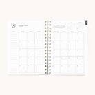 The 2025-2026 Softcover Weekly Simplified Planner - Happy Stripe by Simplified offers an organized layout with a left notes section and mini month views in the top right. Days run Sunday to Saturday, simplifying your planning with ease.