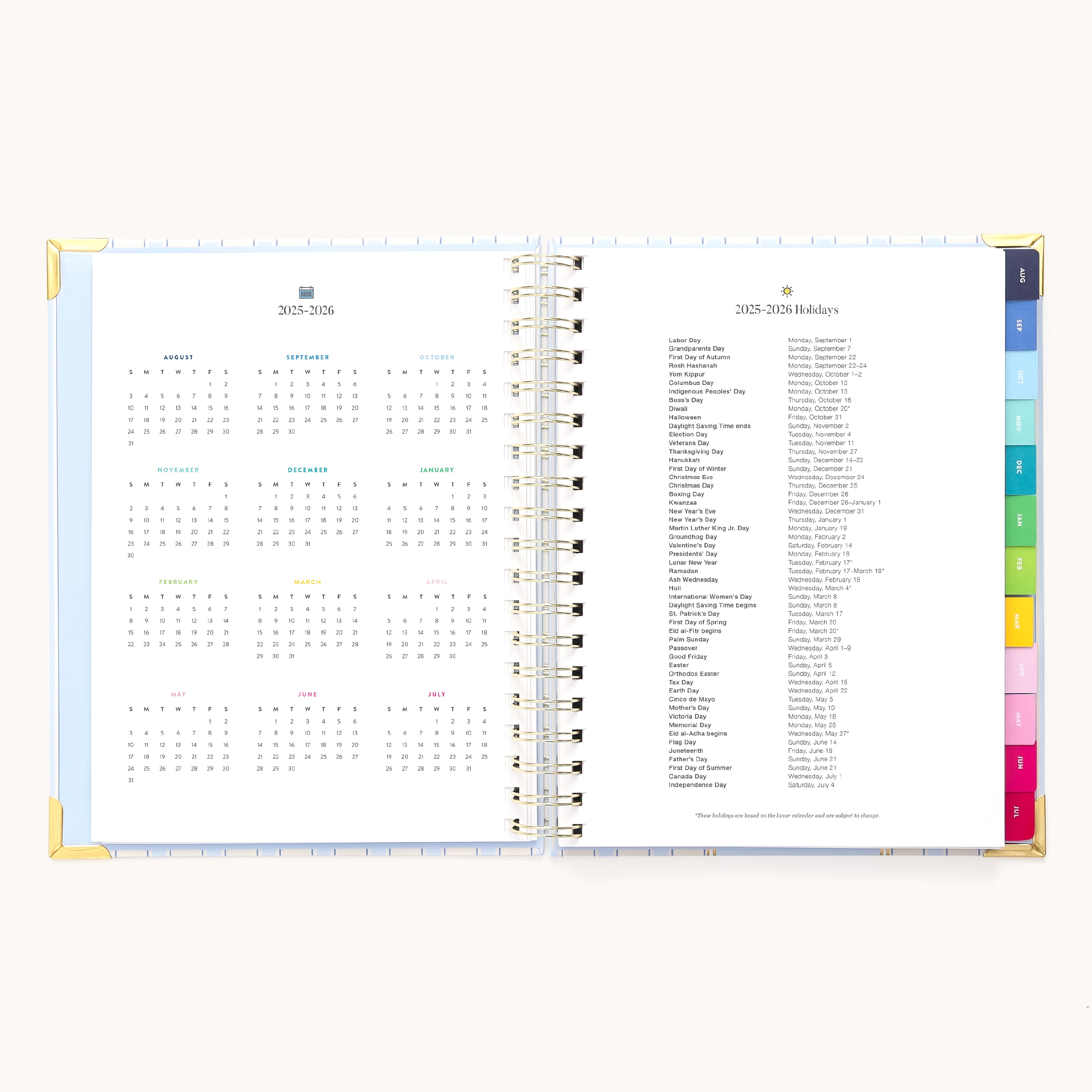 The Simplified 2025-2026 Spiral Weekly Planner in Serene Stripe features a calendar and holiday list, colorful tabs, and gold foil details. Its set against a plain white background for an inspiring organization.