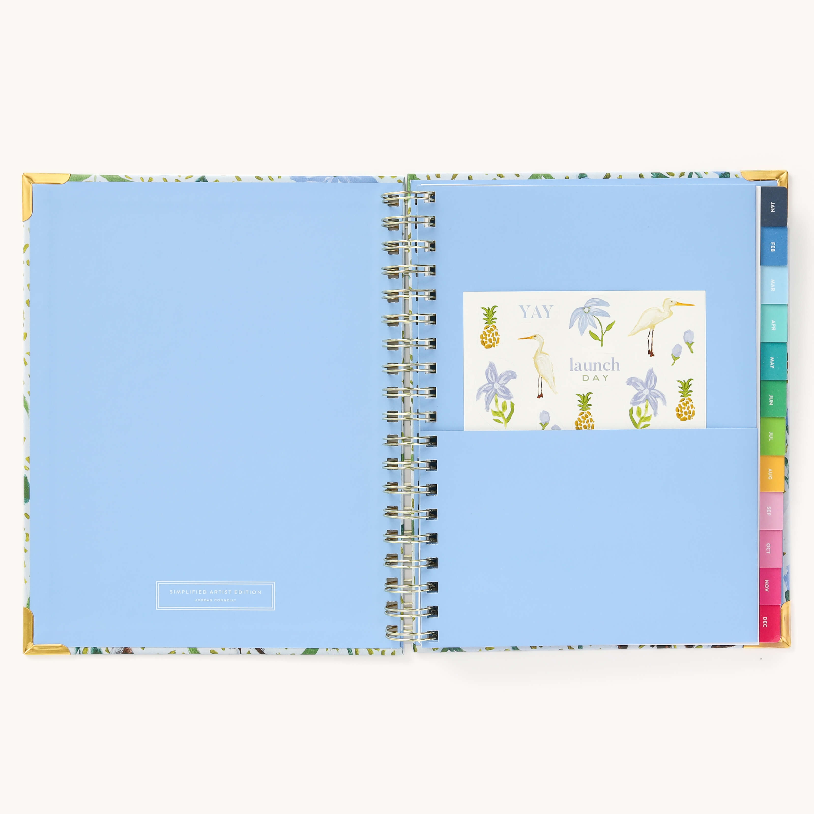 Colorful sticker sheet included in the inner pocket with the 2025 Calendar Year Weekly Simplified Planner by Emily Ley in the Beaufort Birdies cover design for customization.