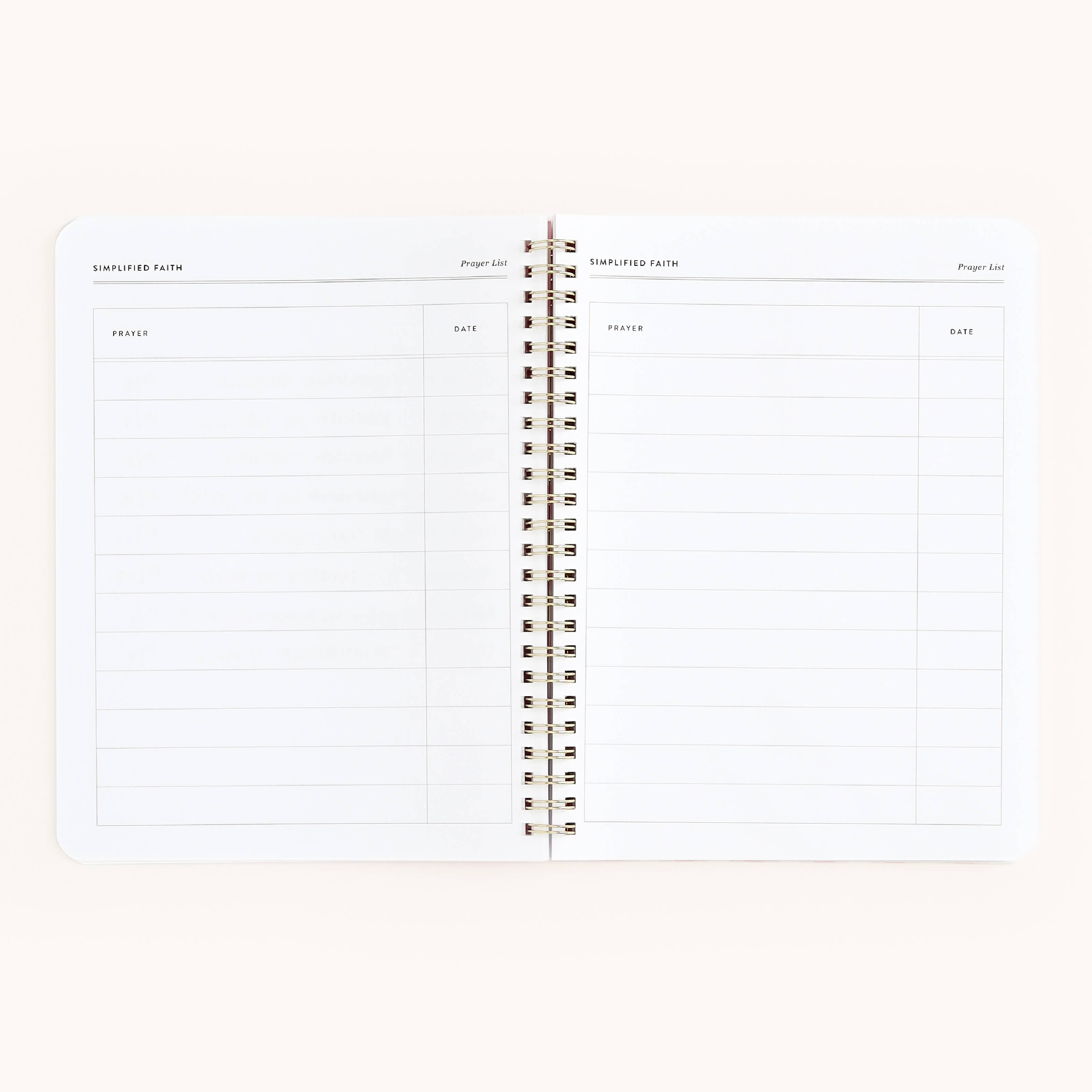 The Simplified Workbook - Faith features an open spiral-bound design with two-page spreads labeled Prayer and Date, offering clean, uncluttered pages ideal for tracking spiritual growth or recording actionable plans and goals.