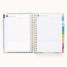 The 2026 Spiral Daily Simplified Planner - Camp Gingham by Simplified features two dated pages with 6 a.m. to 8 p.m. time slots, note lines, and colored tab dividers—ideal for staying organized every day in 2026.