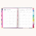 The 2026 Spiral Weekly Simplified Planner - Rainbow Row by Simplified displays a January 2026 monthly calendar, with a notes section on the left and a dated grid plus colored tab dividers on the right—ideal for organized weekly planning.