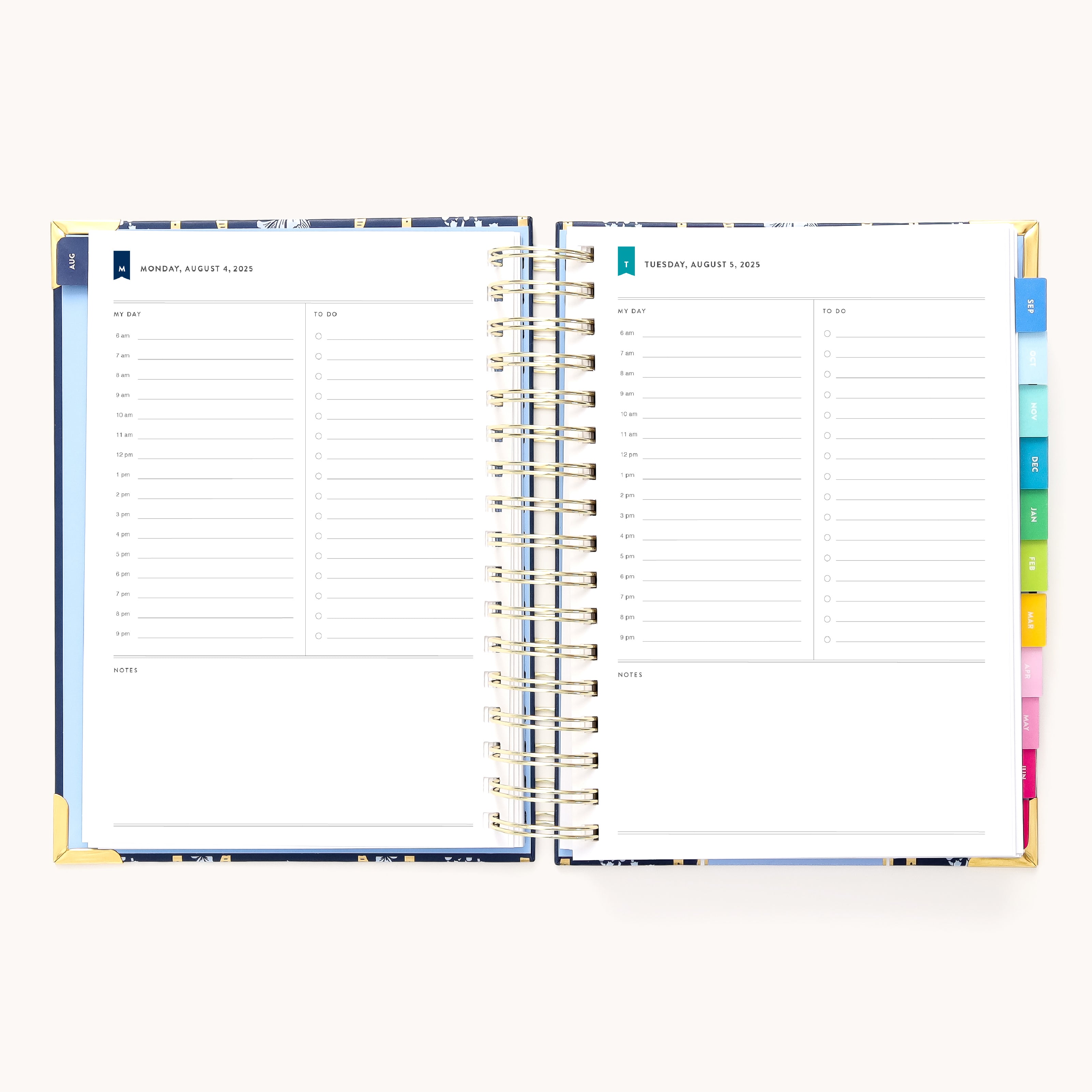The 2025-2026 Spiral Daily Simplified Planner - Poppy Posies by Simplified, adorned with gold foil details, shows pages for Monday, August 7, and Tuesday, August 8. Each page has hourly slots from 6 AM to 8 PM and a notes section. Colorful tabs adorn the right edge of this planner.