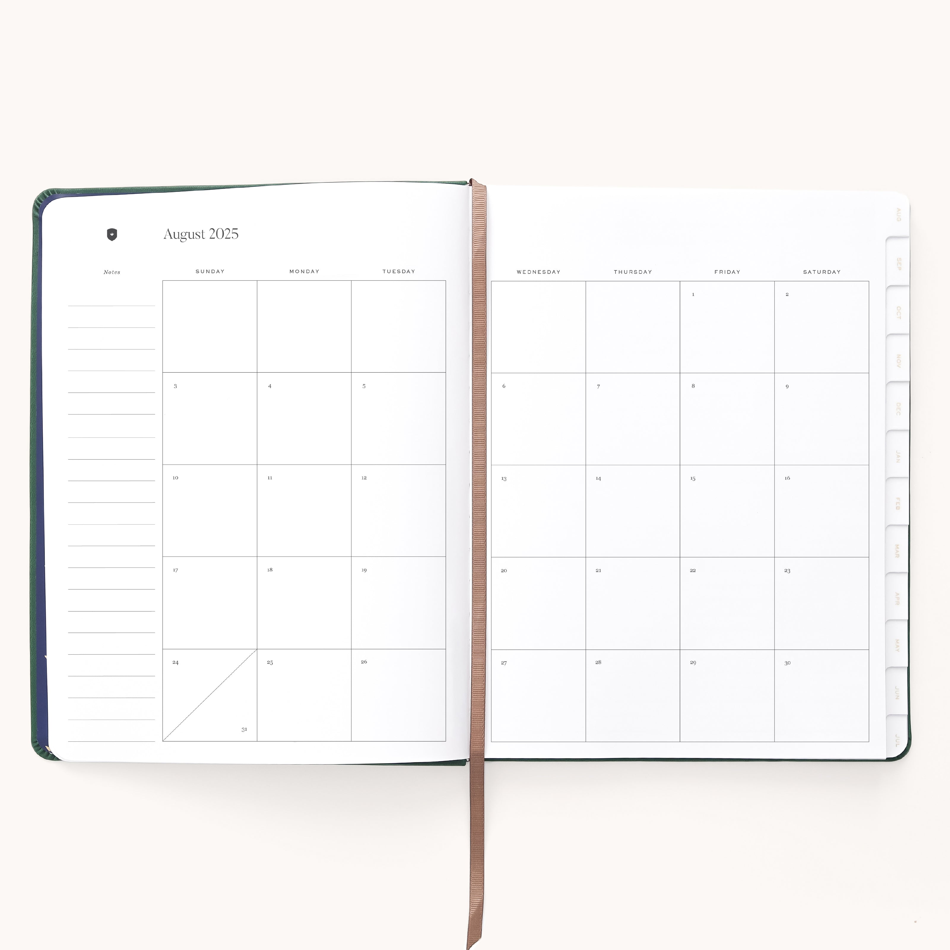 The Simplified 2025-2026 Bookbound Weekly Dapperdesk Planner - Evergreen elegantly showcases an August 2025 monthly calendar. The left page offers space for notes, the right features a Sunday-to-Saturday grid, and a brown ribbon bookmark marks the center of this refined 12-month planner.