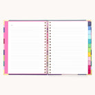The 2025-2026 Spiral Weekly Simplified Planner - Rainbow Row by Simplified features an open design with lined white pages, multicolored margins, dividers with tabs for organization, and gold foil accents on the cover. A faint header reads Notes on one page against a plain background.