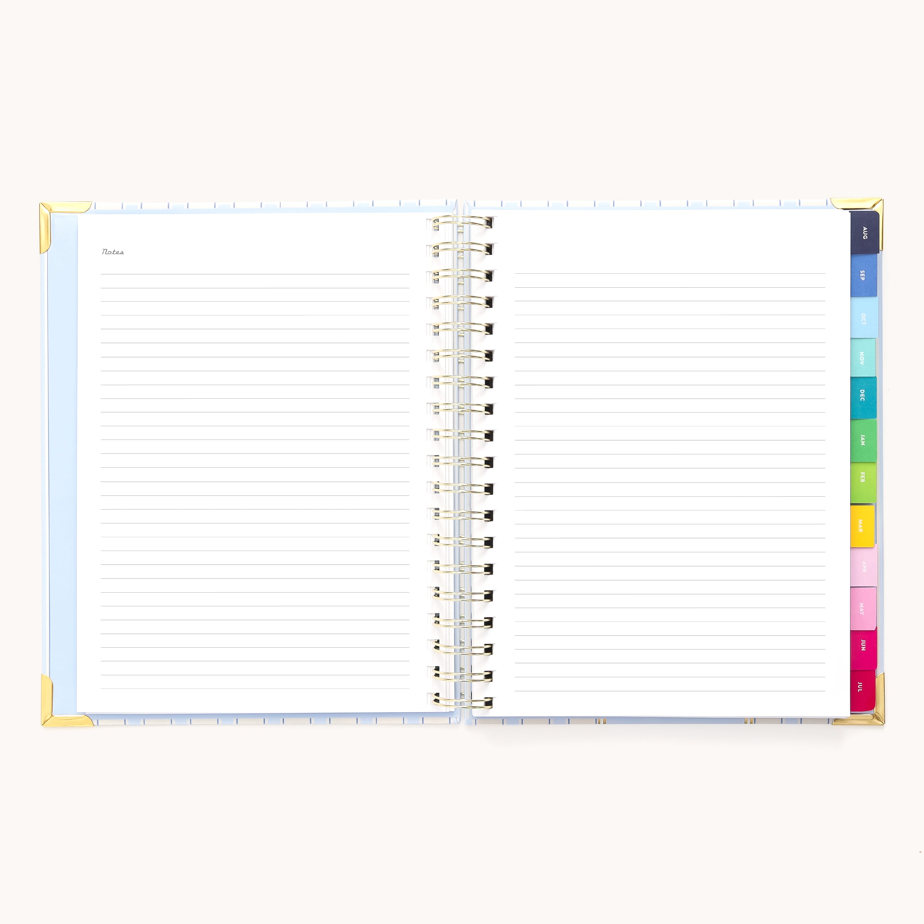 A 2025-2026 Spiral Weekly Simplified Planner - Serene Stripe by Simplified features lined pages, spiral binding, colorful tabbed dividers labeled 1 to 7, and gold foil reinforced corners for an elegant finish.
