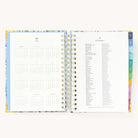 2025 Daily Simplified Planner by Emily Ley in the Beaufort Birdies cover design open to the yearly calendar overview and holidays list. Features a two-page spread with a full 12-month calendar view on the left and important U.S. holidays on the right.