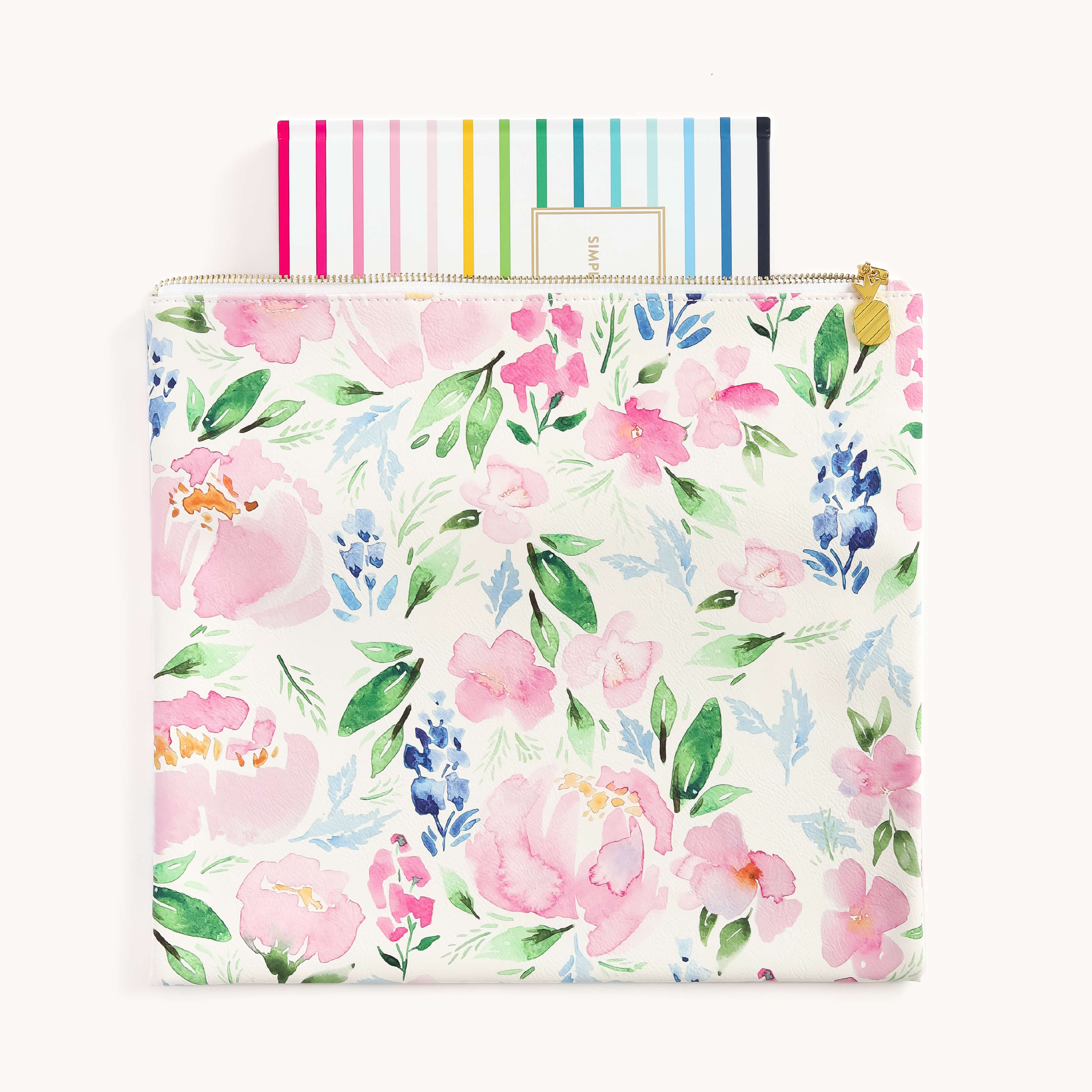 The Planner Pouch - Cottage Floral by Simplified offers a stylish storage solution with its watercolor floral design in pink, blue, and green. Made from durable leatherette, it reveals colorful striped notebooks tucked inside.