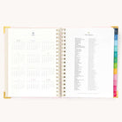 2025 Weekly Simplified Planner by Emily Ley in the Blush Block cover design open to the yearly calendar overview and holidays list. Features a two-page spread with a full 12-month calendar view on the left and important U.S. holidays on the right.